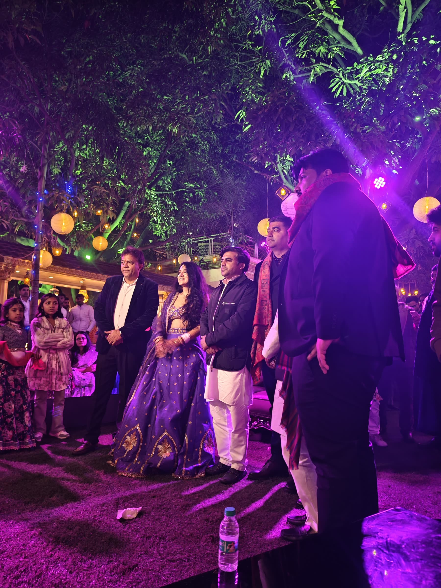 Wedding celebration under purple and magenta lights