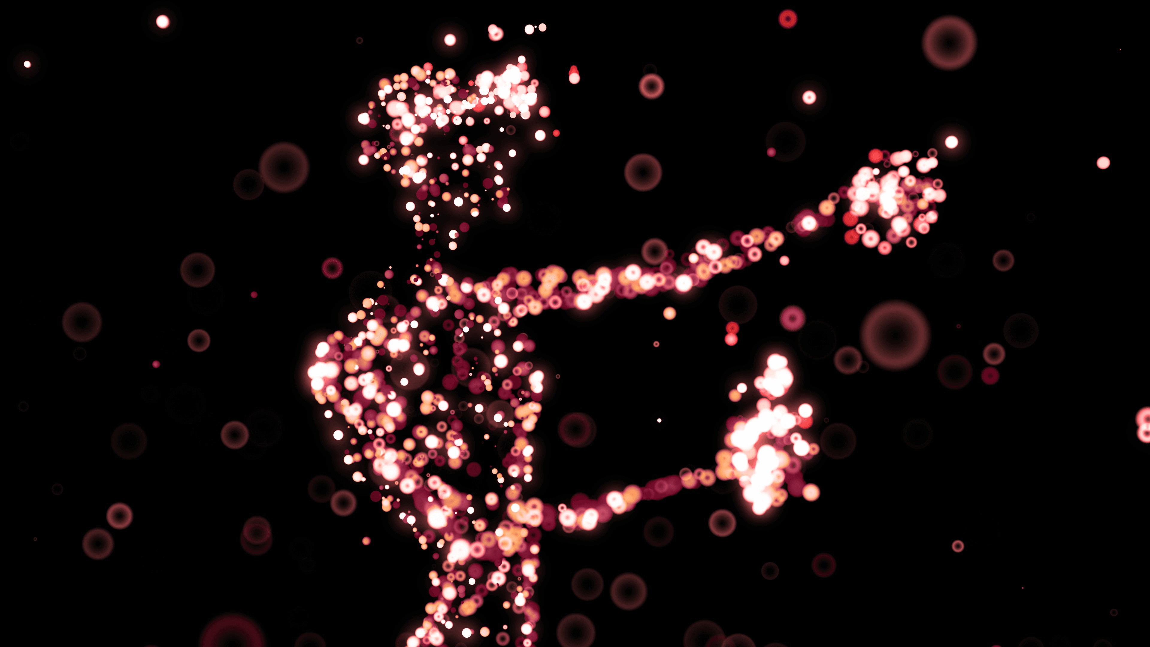 A person in a VR scenario formed as a silhouette of red bubbles in varying shapes, opacities and color tones in a black background.