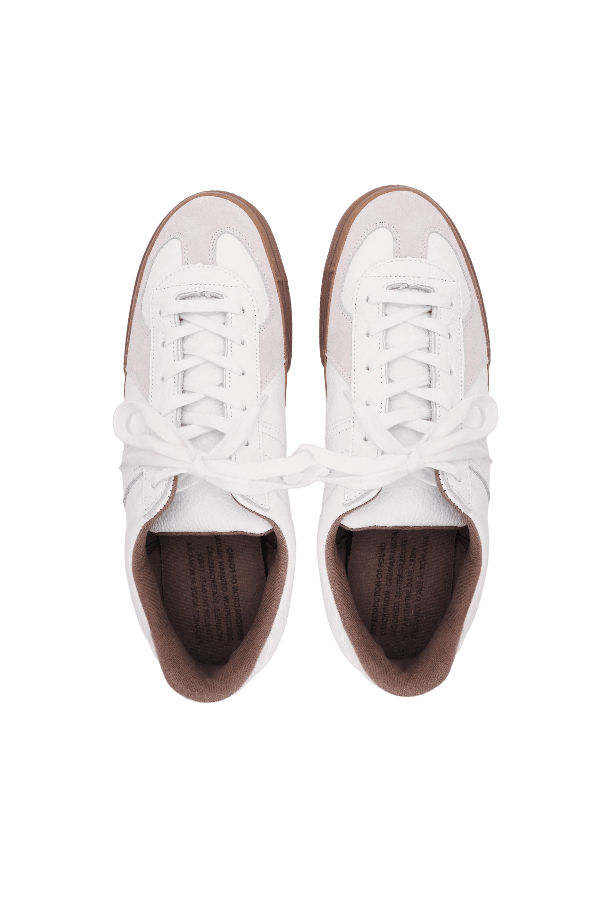 drone shot of a pair of white trainers