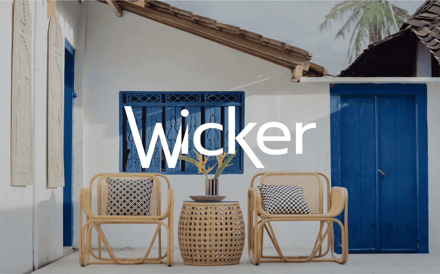 Wicker furniture in front of a house.