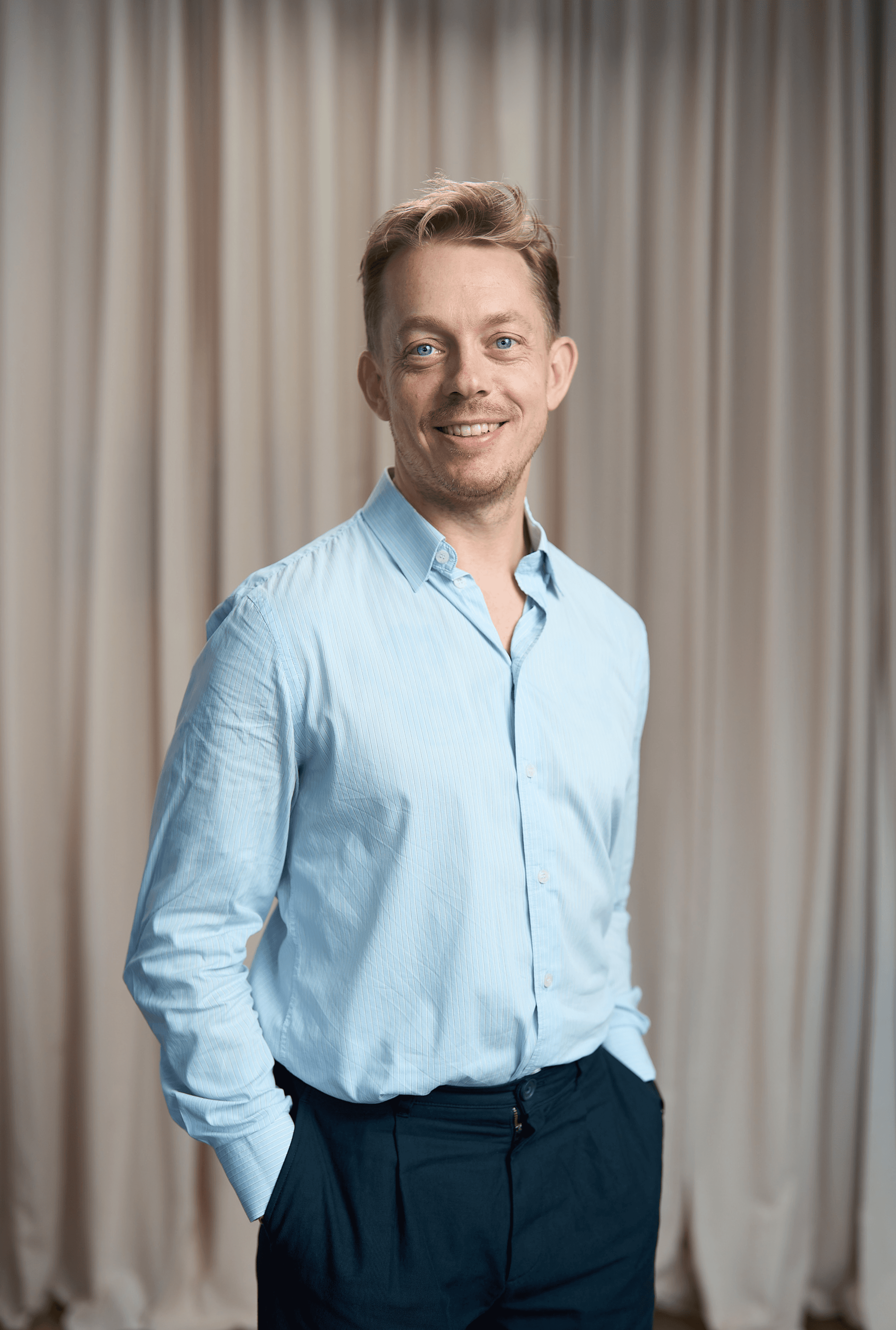 man standing beside wall