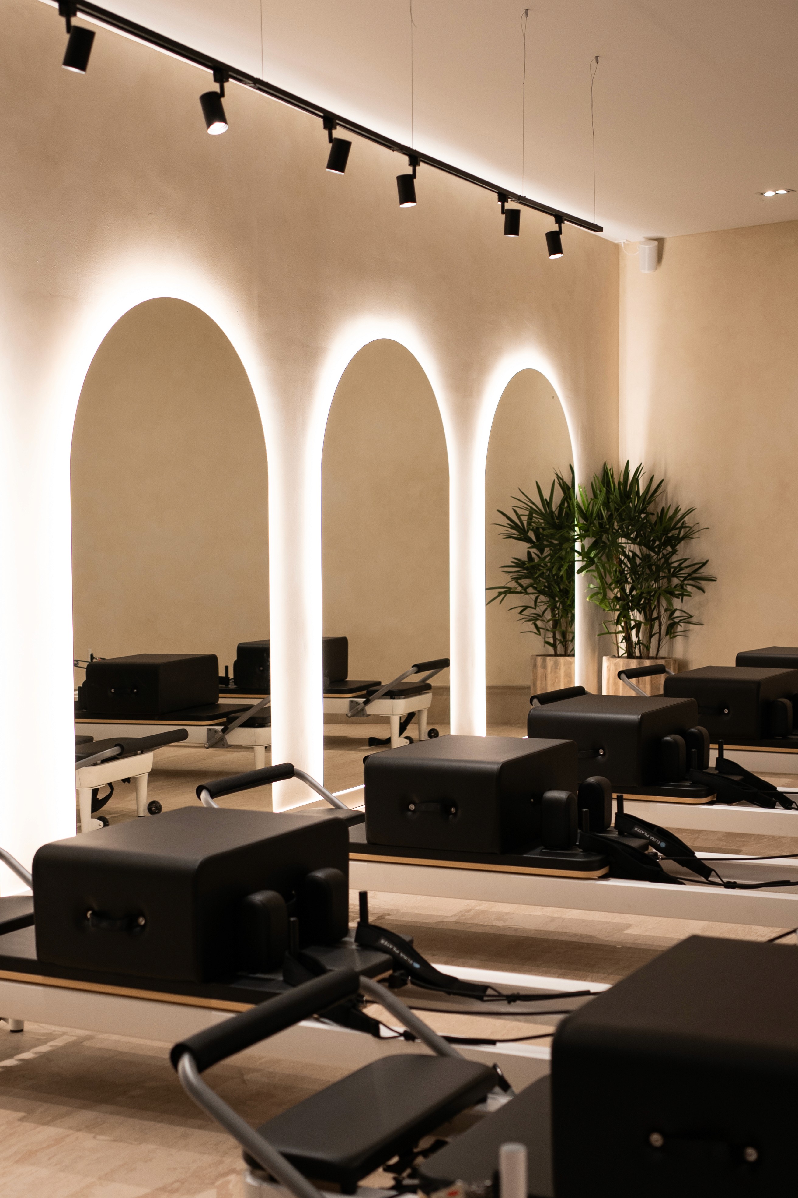 A group of people praticing yoga on the beach in the morning