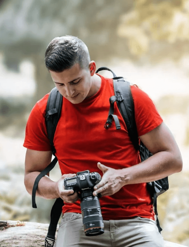 headshot of male in dark background