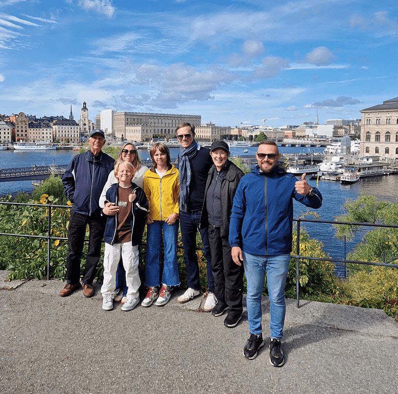 Tourists exploring Stockholm during private electric sightseeing cart tour