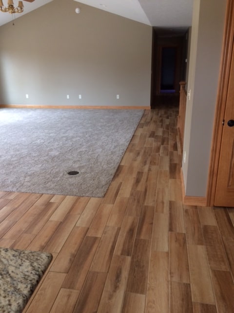 Area carpet enhancing hardwood flooring in a customer's home in South Bend