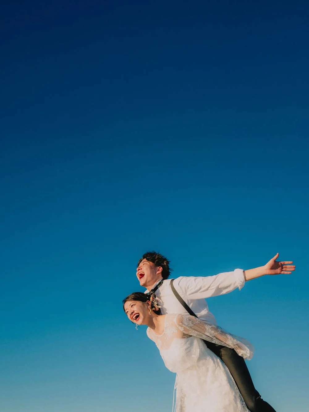Abstract glowing orange book-shaped form on a dark background