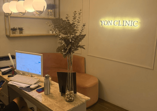 Modern hospital reception area with a white desk