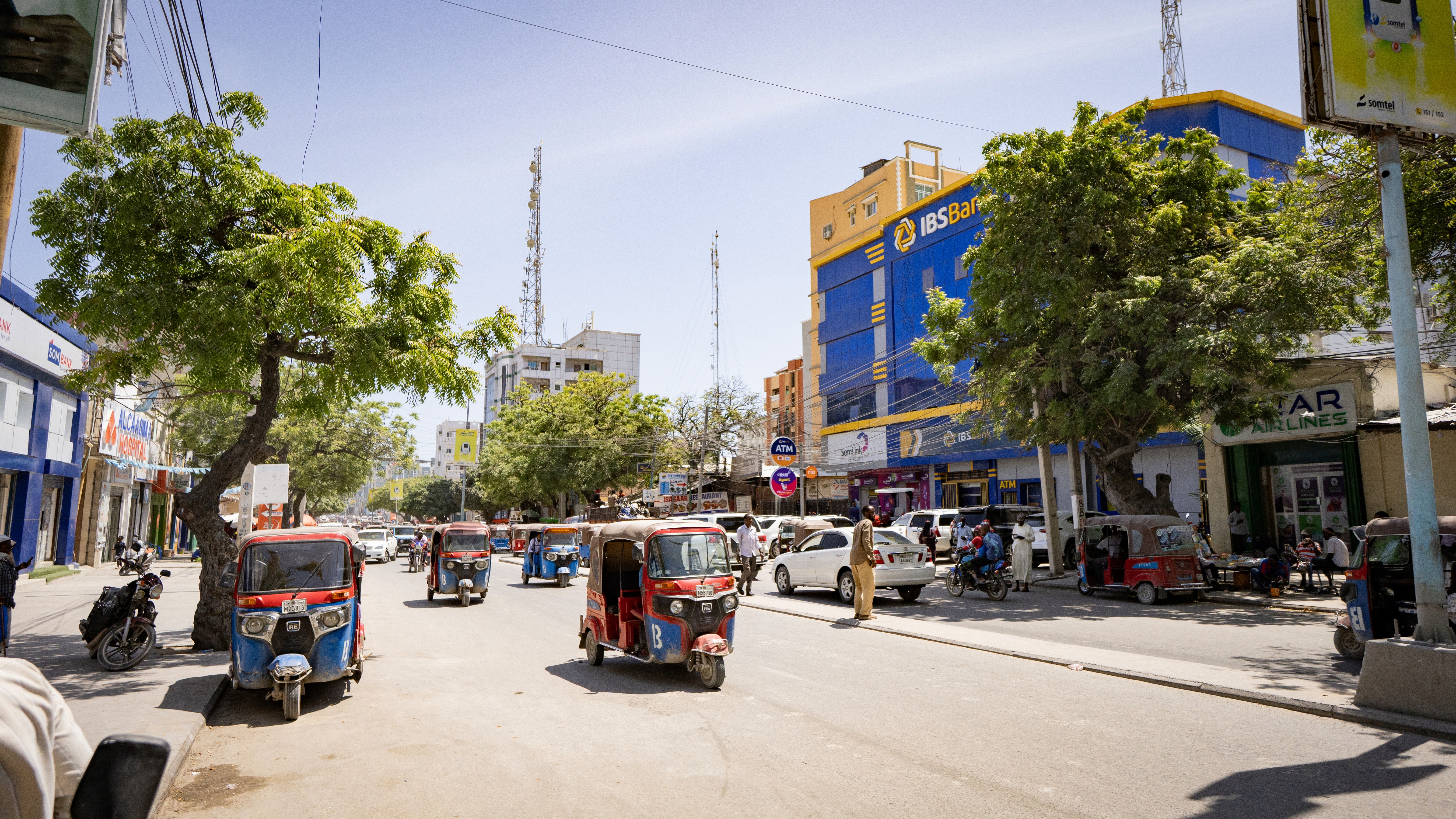 a man looking at a train on the tracks