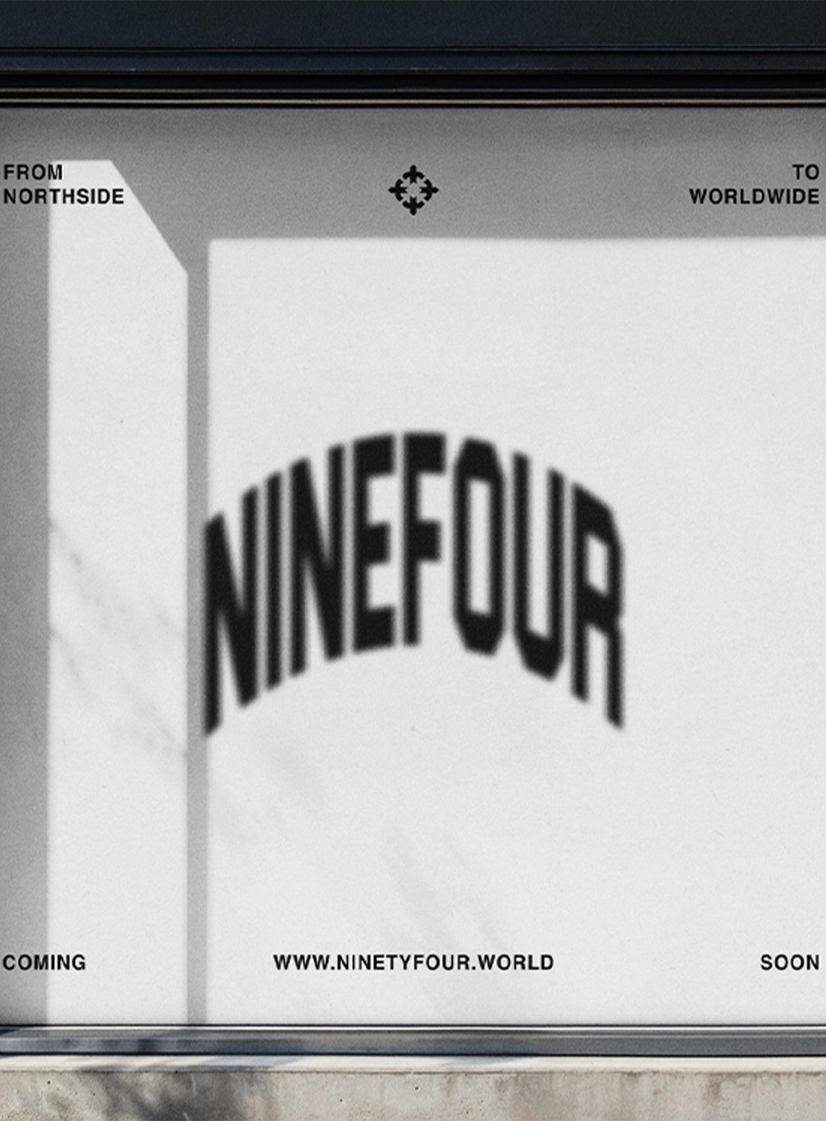 Glossy black cylindrical container with detail on white