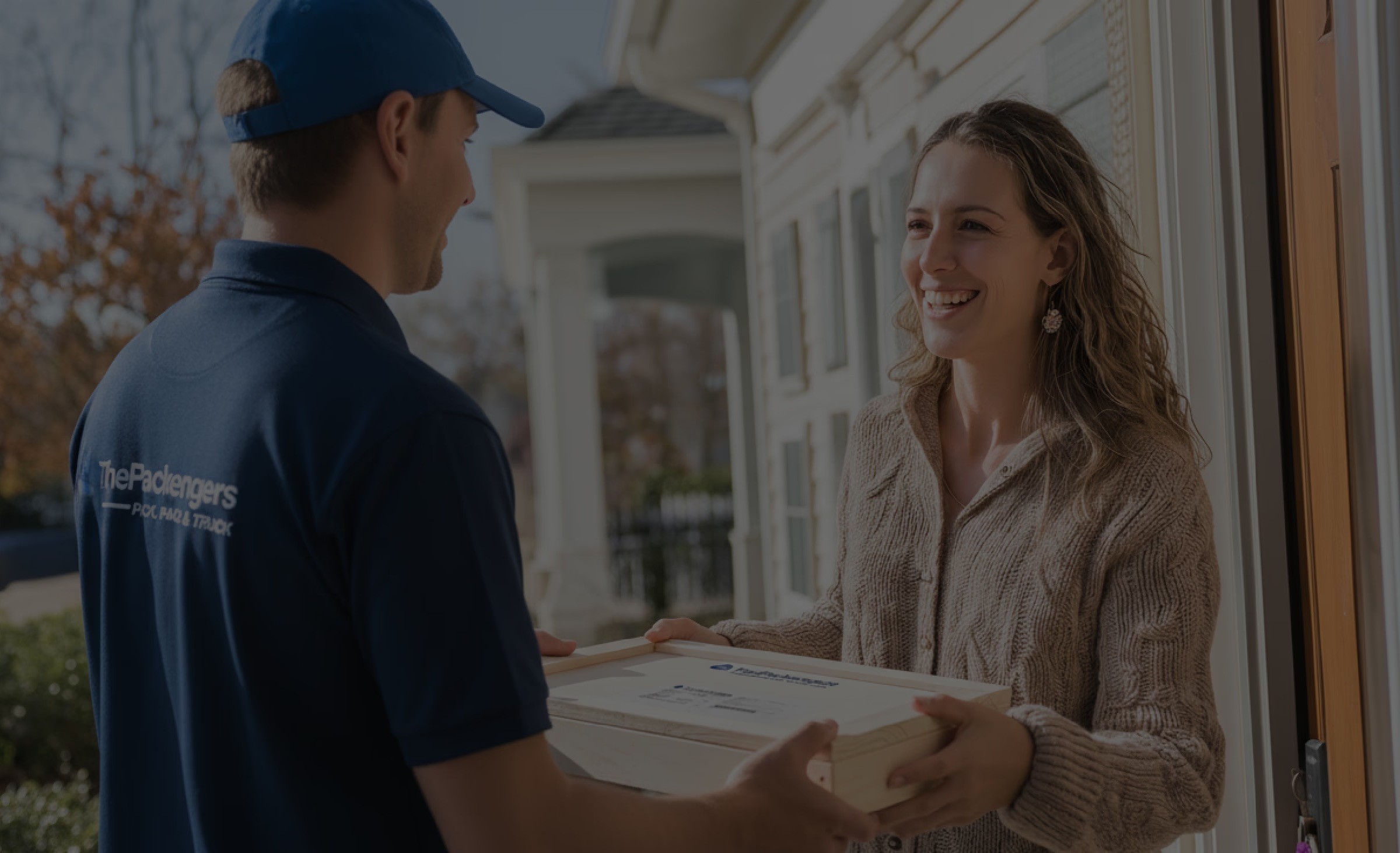 Woman happily receives package from thepackengers delivery guy