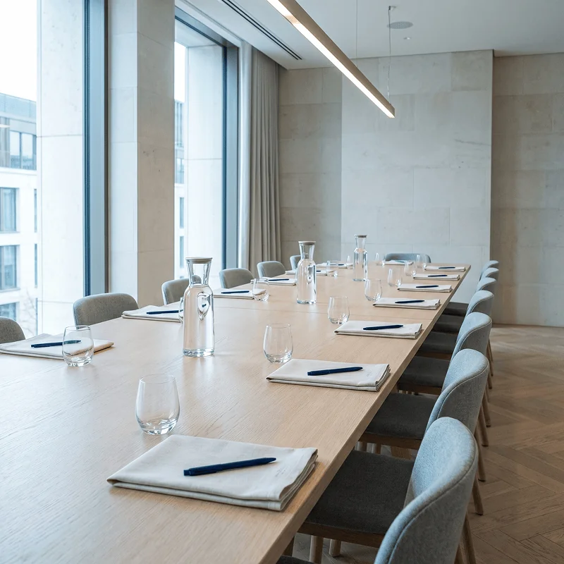 An empty contemporary hotel meeting room prepared for a group