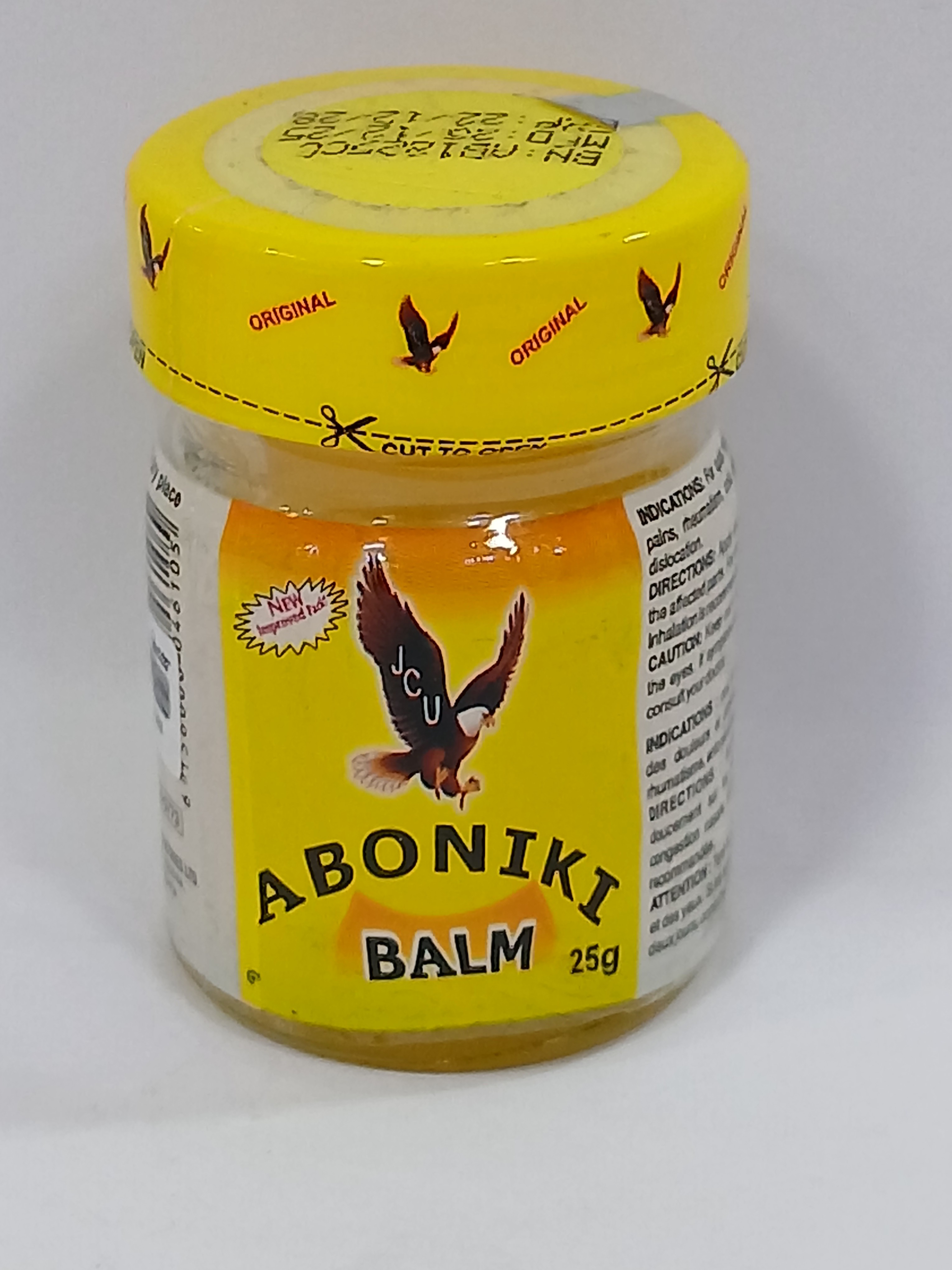 A small, clear glass jar with a yellow screw-on cap contains a yellow balm, featuring a label with an eagle and the text "ABONIKI BALM 25g" on a yellow background, against a plain white background.