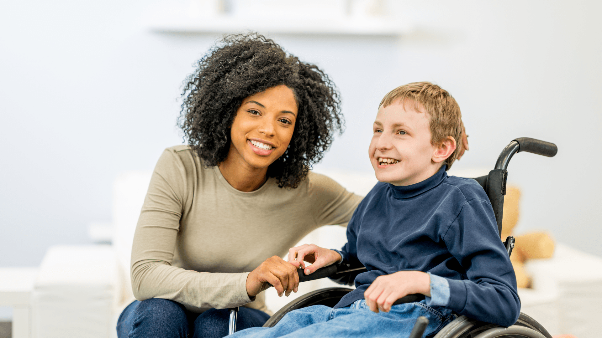 Female caregiver with a boy with developmental disability