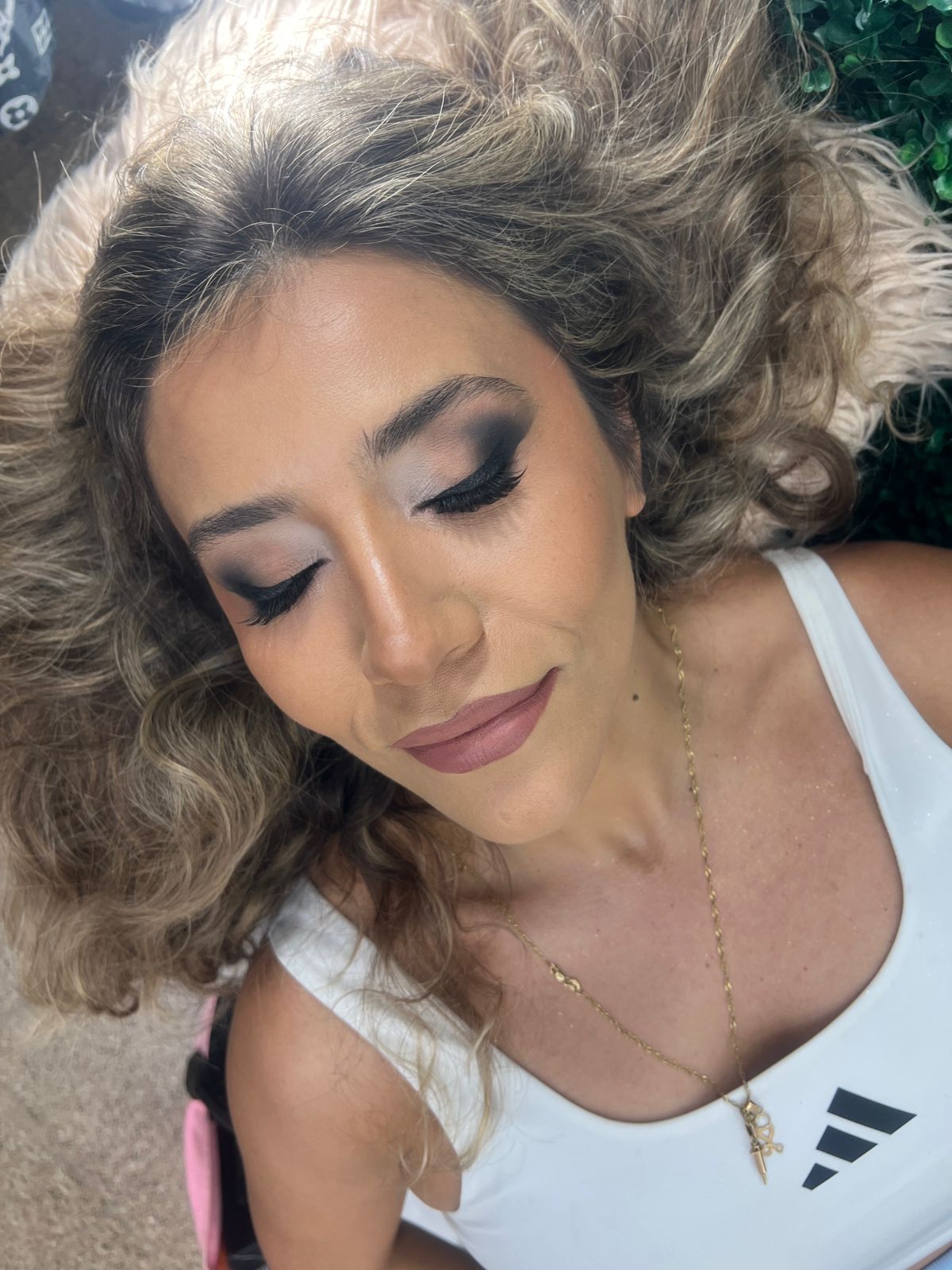girl in a dark green shirt, after makeup