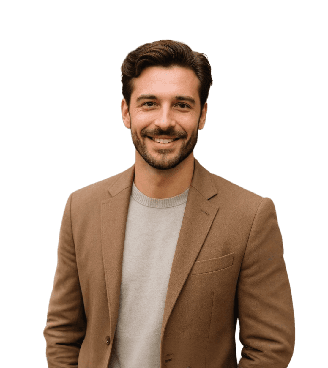 A man in a tan suit smiles warmly, exuding confidence and approachability.