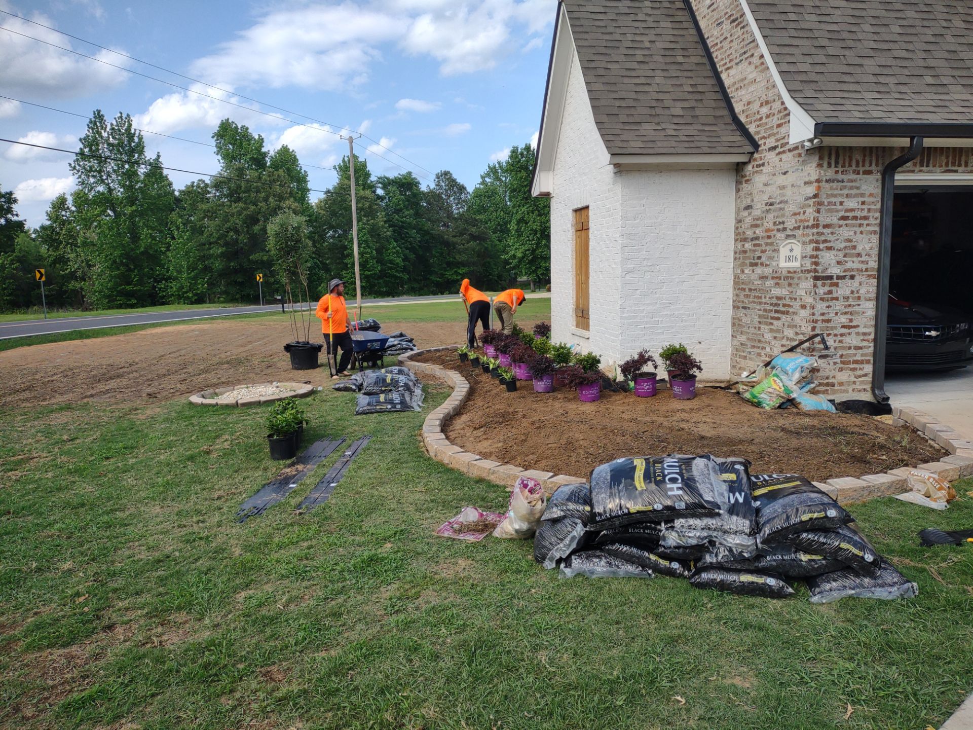 Landscaping in Shreveport with professional flower bed design and plant installation.