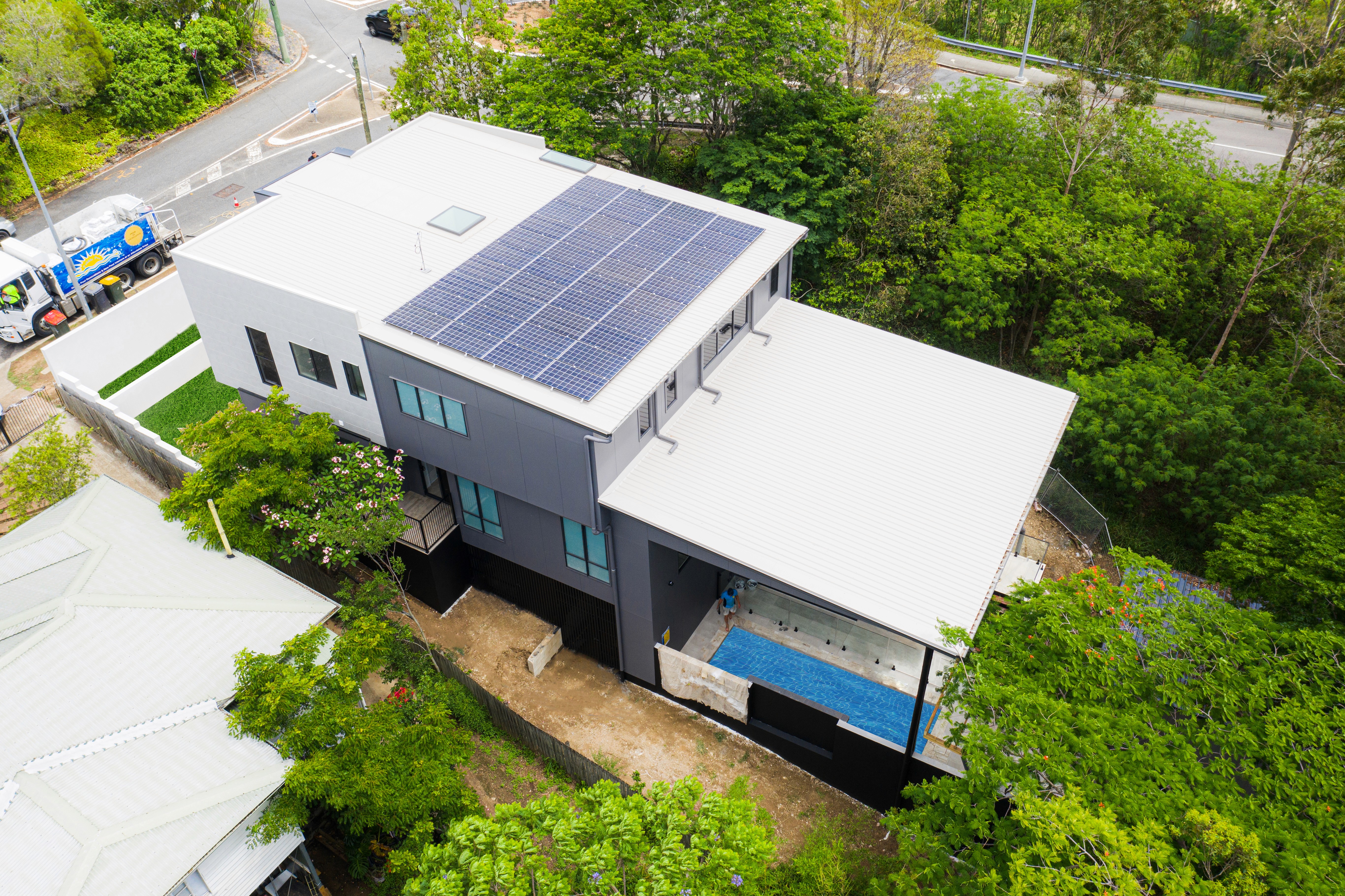 Downward sloping block custom house design from the rear elevation.