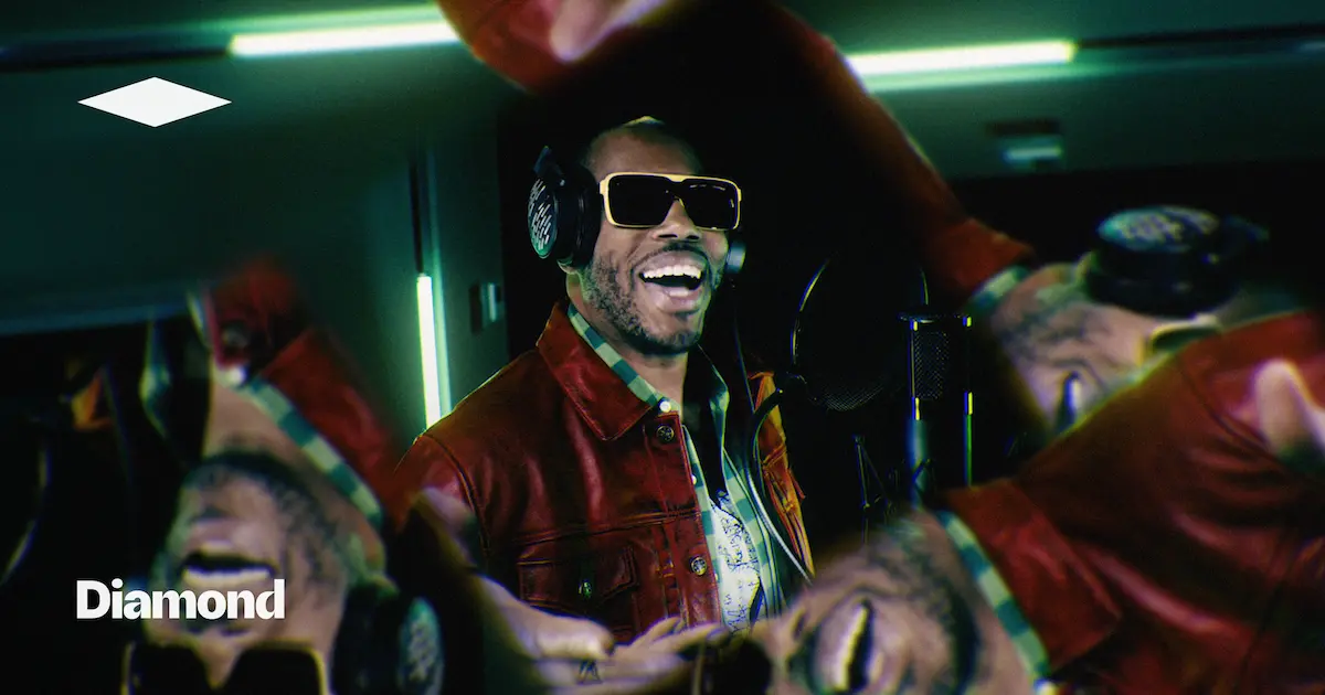 Man wearing headphones and sunglasses in a neon-lit mirrored scene