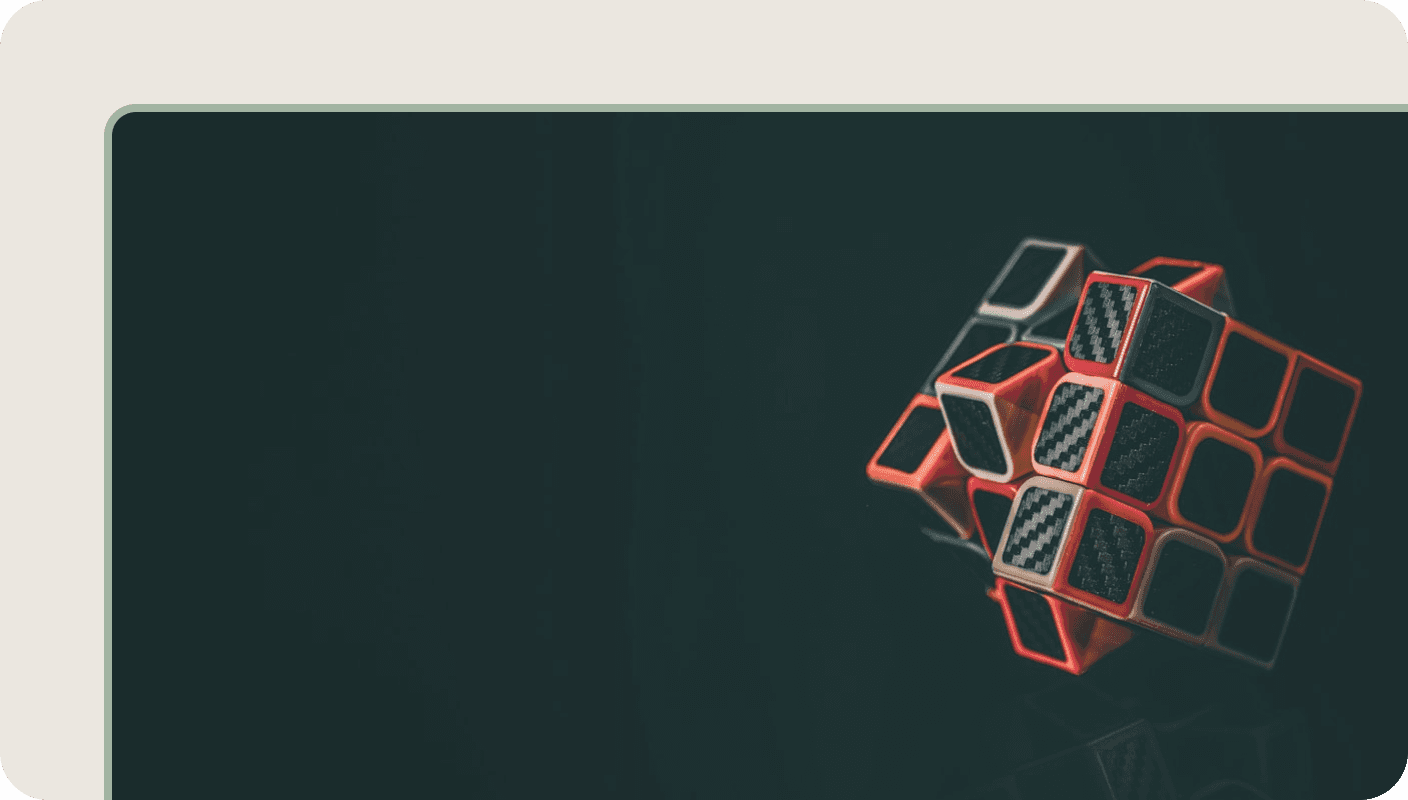 Rubik's cube with glowing orange and pink edges representing problem-solving and reframing challenges