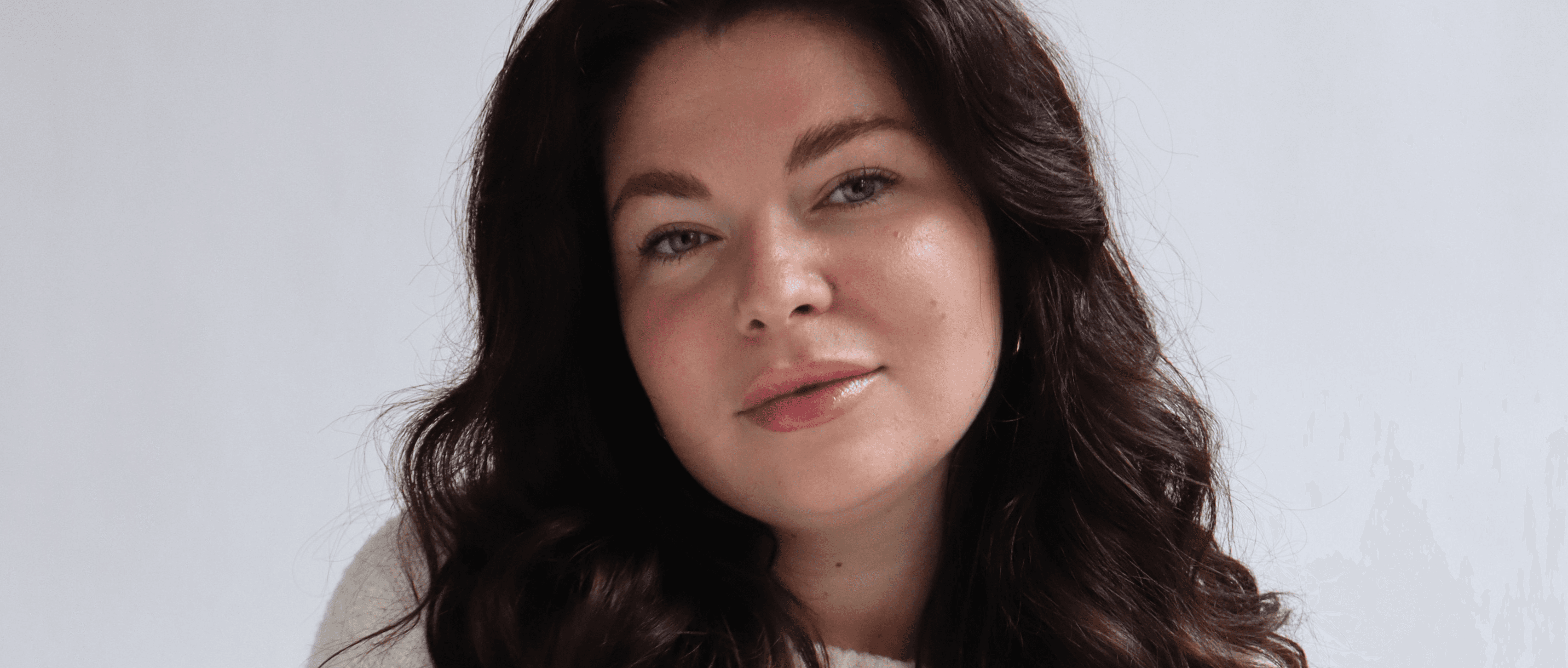 Laptop displaying website on wooden table