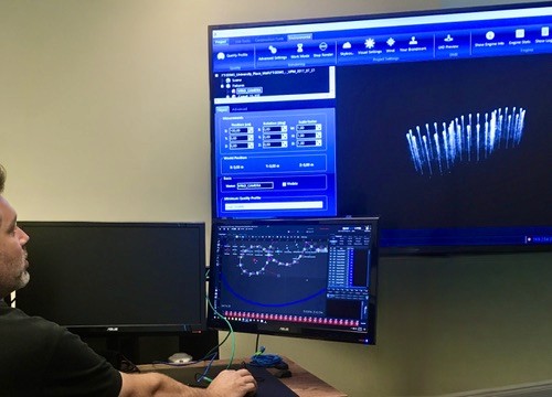 MAN. AT COMPUTER ANIMATING FOUNTAINS