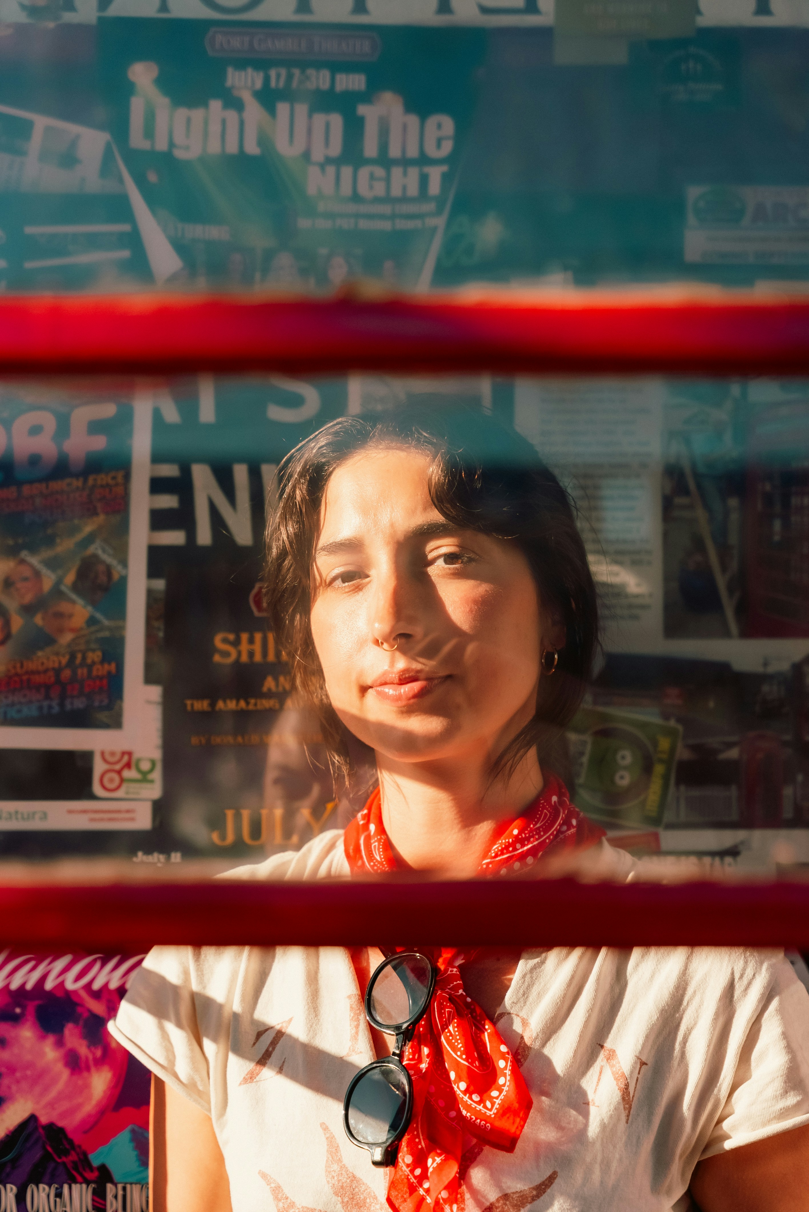 A woman looks through a window.