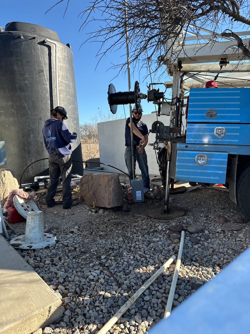 Technician documenting well pump diagnostic findings 