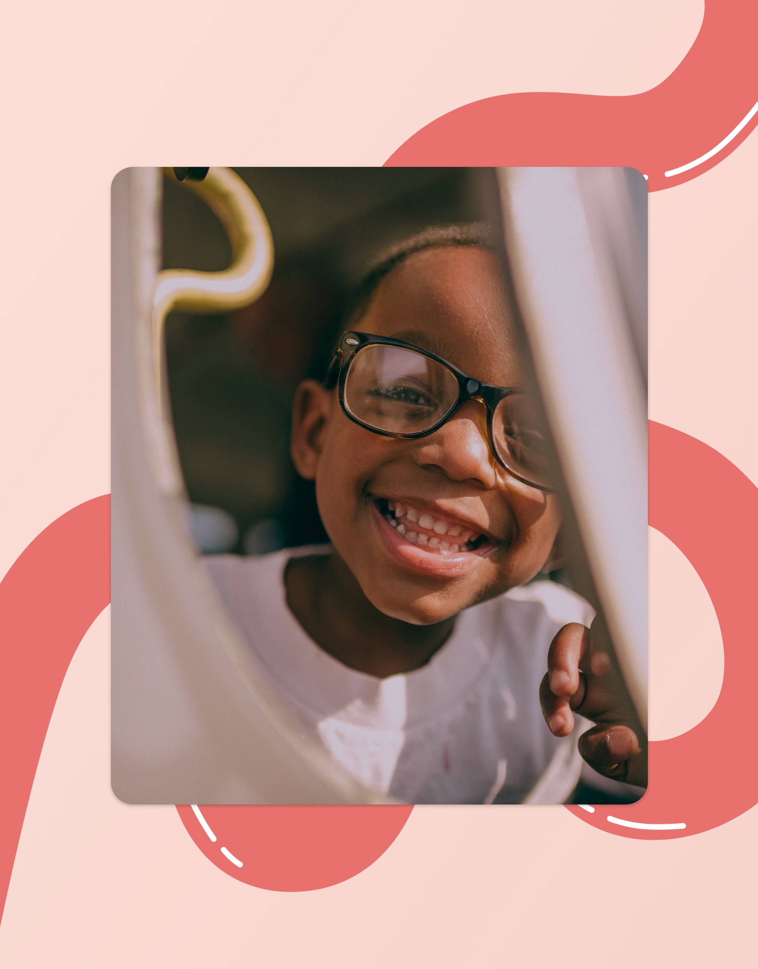 A young child wearing glasses smiles joyfully while peeking through a play structure, with colorful abstract patterns in the background, capturing a moment of playful happiness and childhood joy.