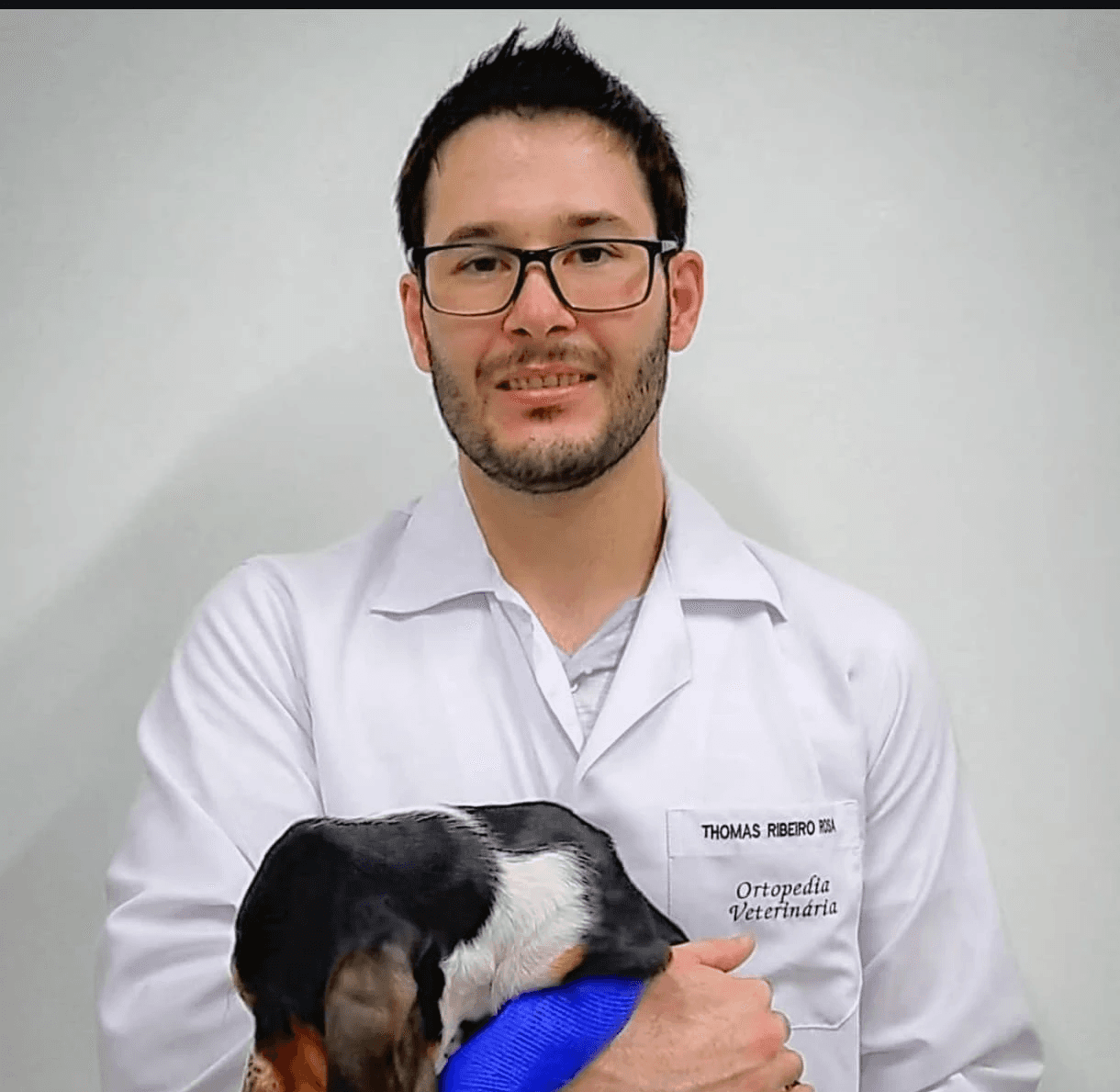 man in blue crew neck t-shirt smiling