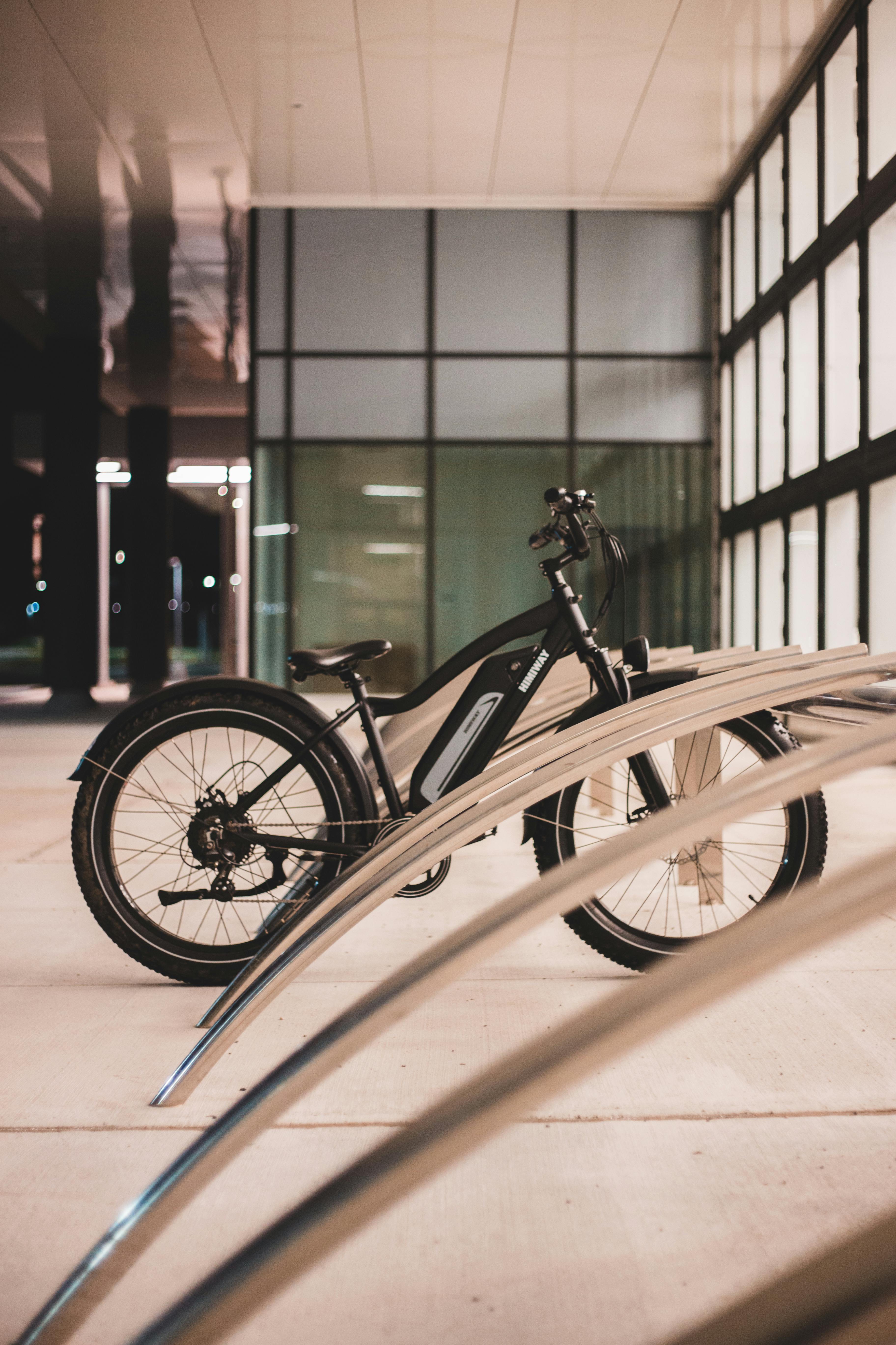Stack of modern books and magazine with minimalist cover design on leather chair
