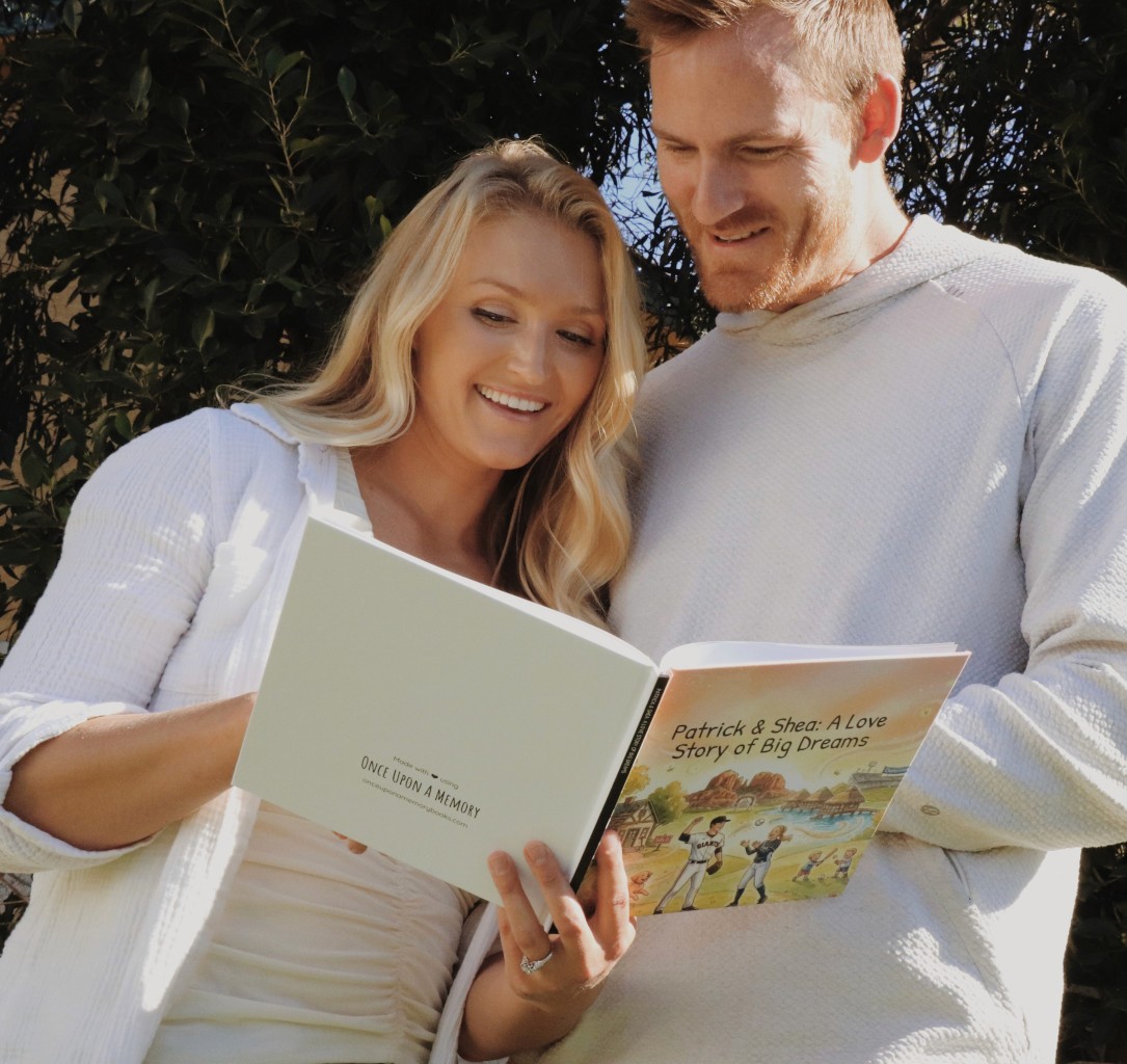 Smiling young man with short hair poses against a dark background, wearing a green button-up shirt.