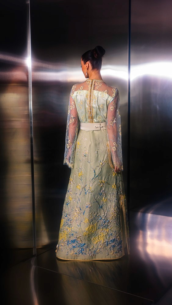 Beige and gold Moroccan caftan with blue embroidery, handcrafted couture piece designed for luxury occasions in Bahrain