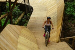 woman mountain biking on the curliest
