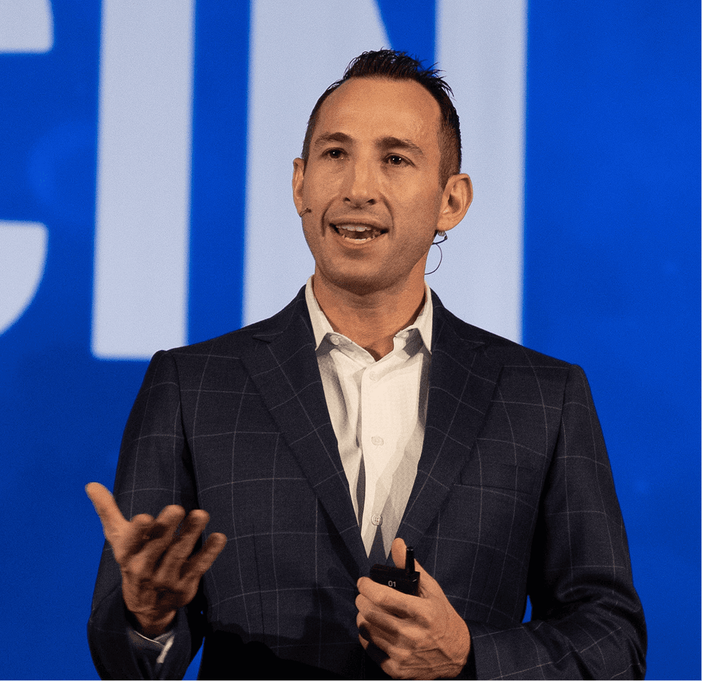Brandon speaking at event