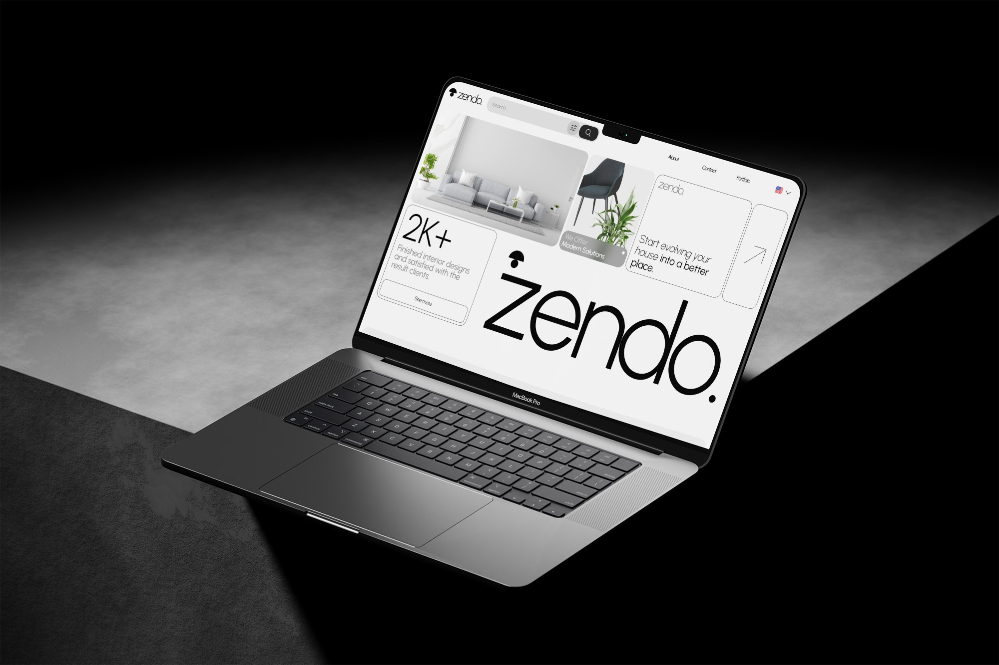 Laptop on concrete, website on screen