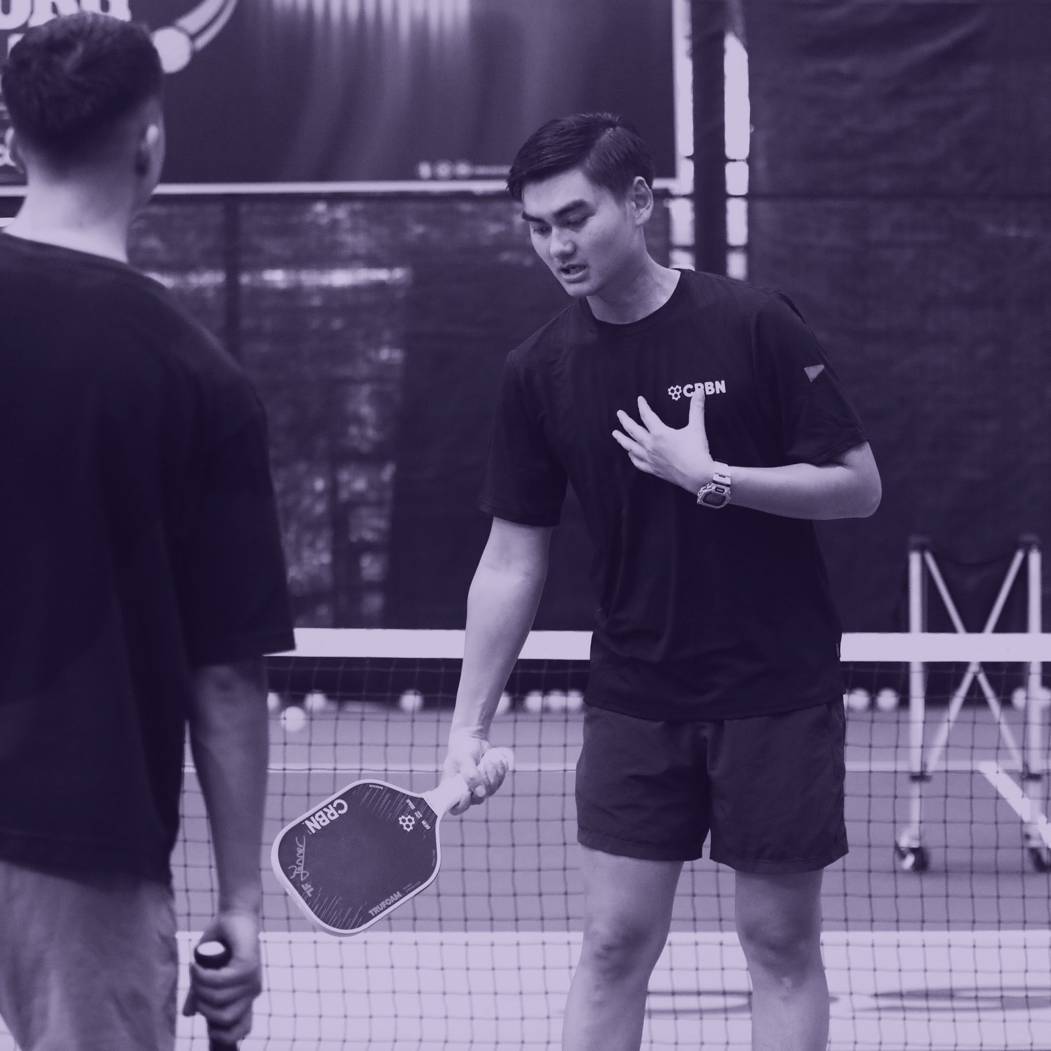 A man standing with Sufboard