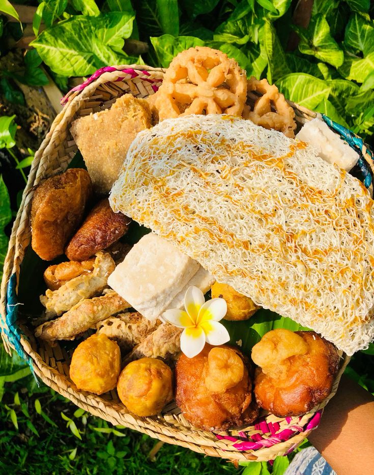 A man playing a drum in front of a group of people