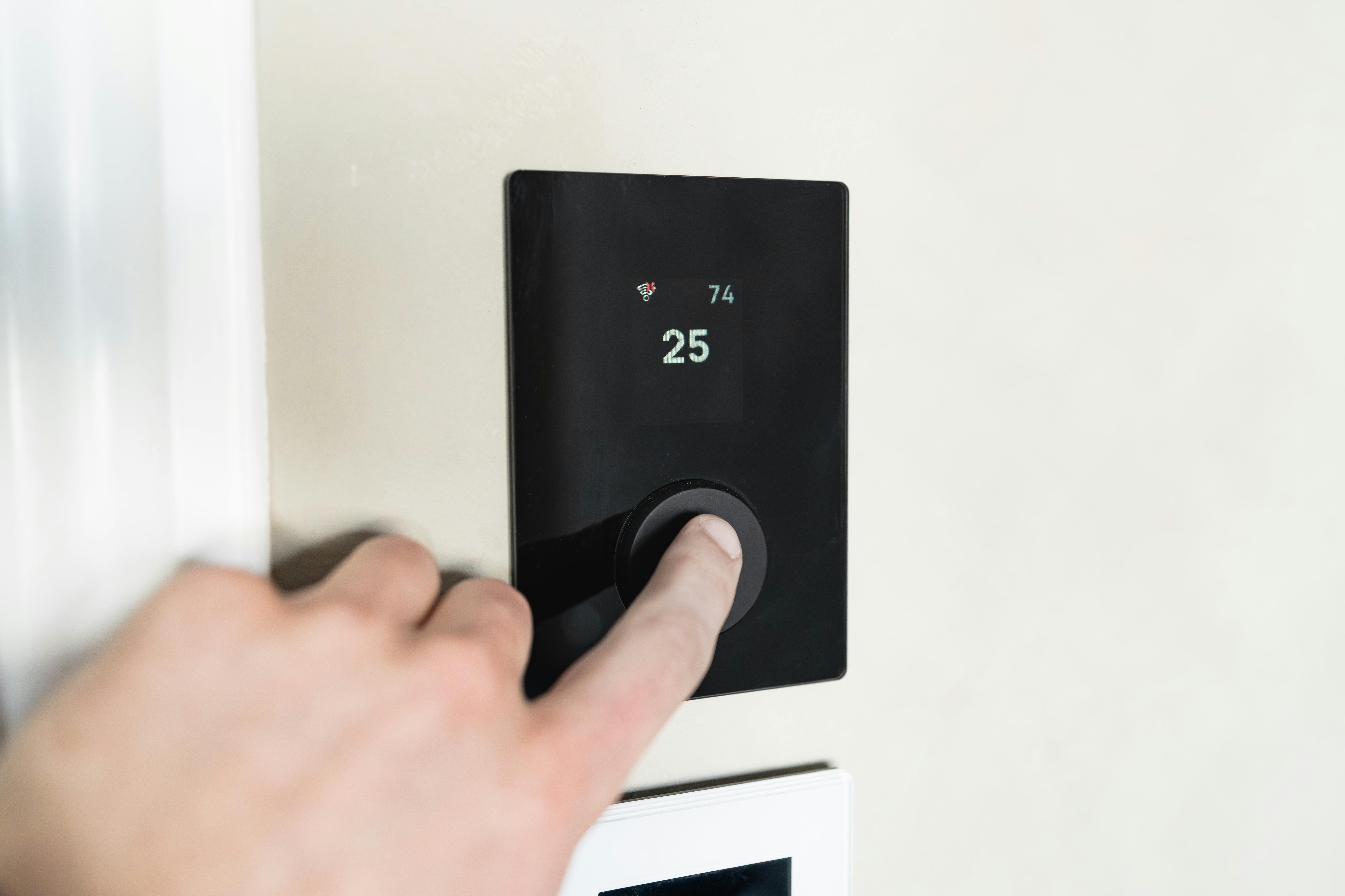 Heat pump controller screen showing weather compensation curve settings adjusting flow temperature based on outdoor temperature in a UK home