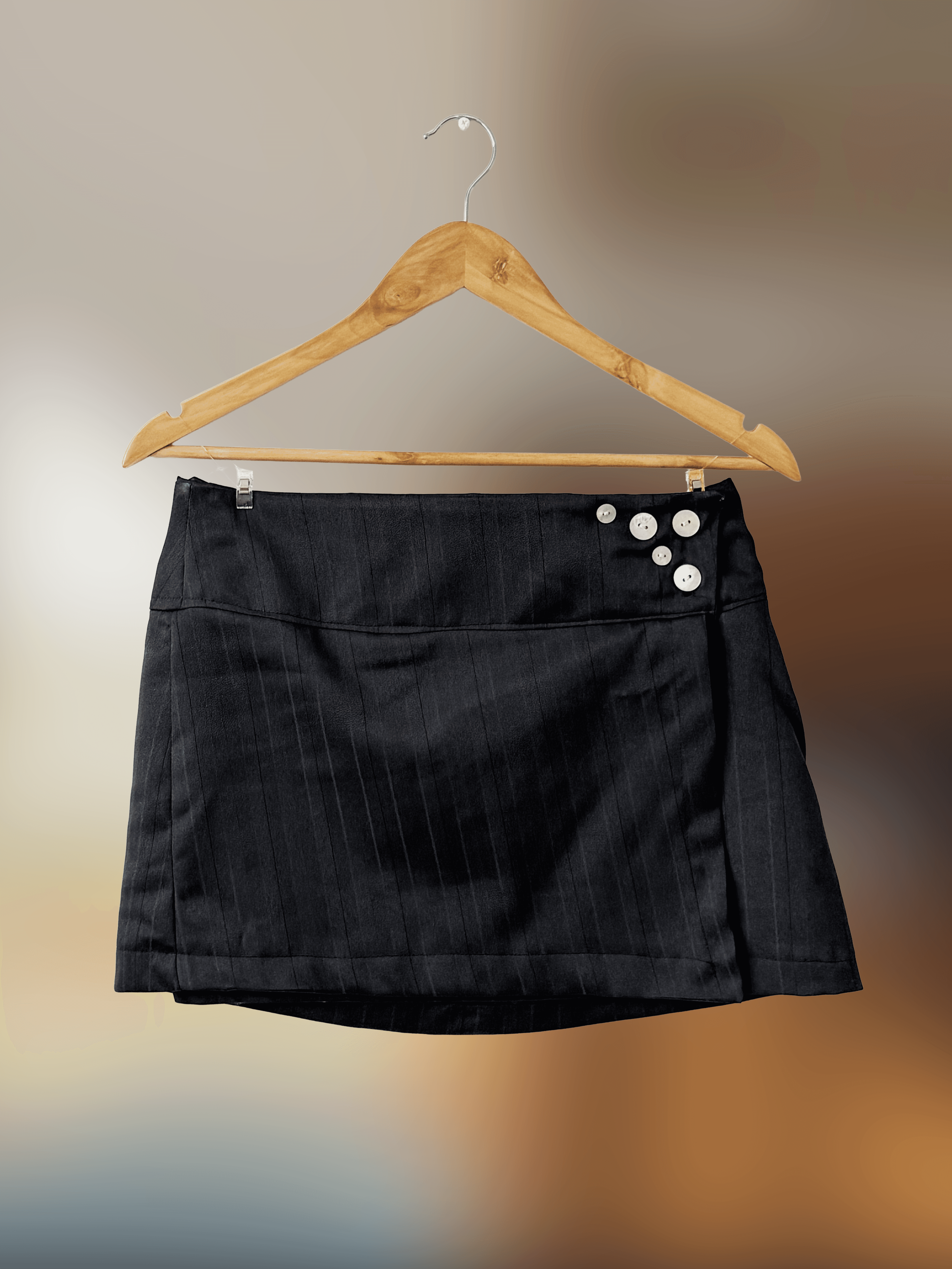 Front of black pin-stripe short skirt with buttons 