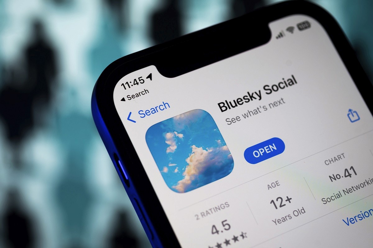 A phone screen shows the Bluesky Social app on the App Store with a rating of 4.5 stars and an age rating of 12+, indicating its rise in popularity.