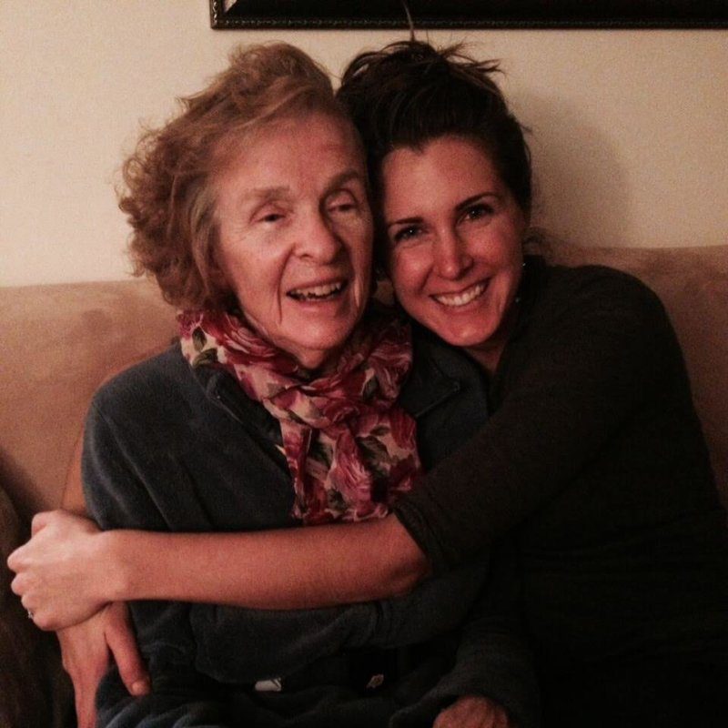 Abby smiling, hugging her grandma
