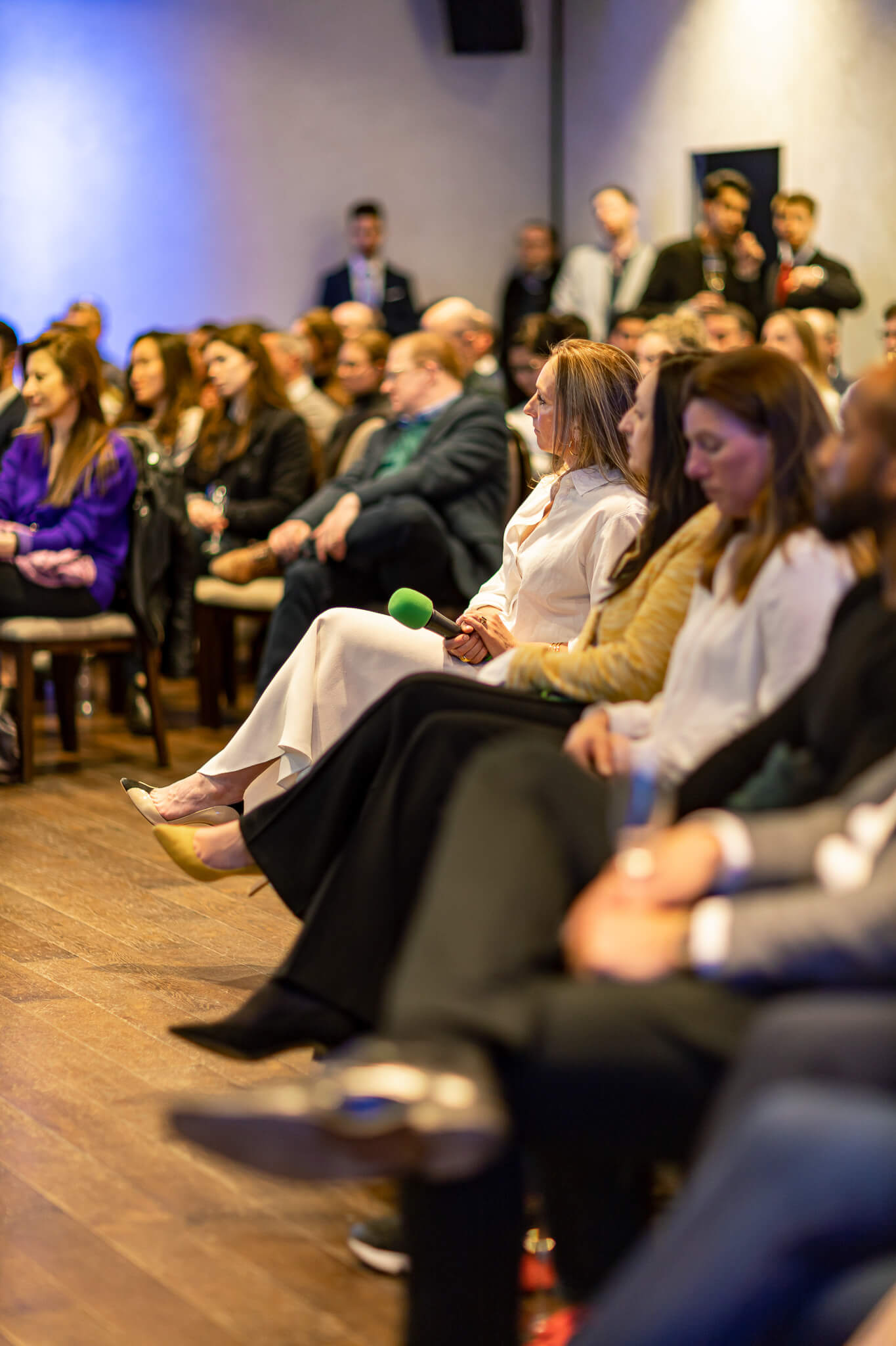 Audience listening to a speaker during a women in finance networking and business event