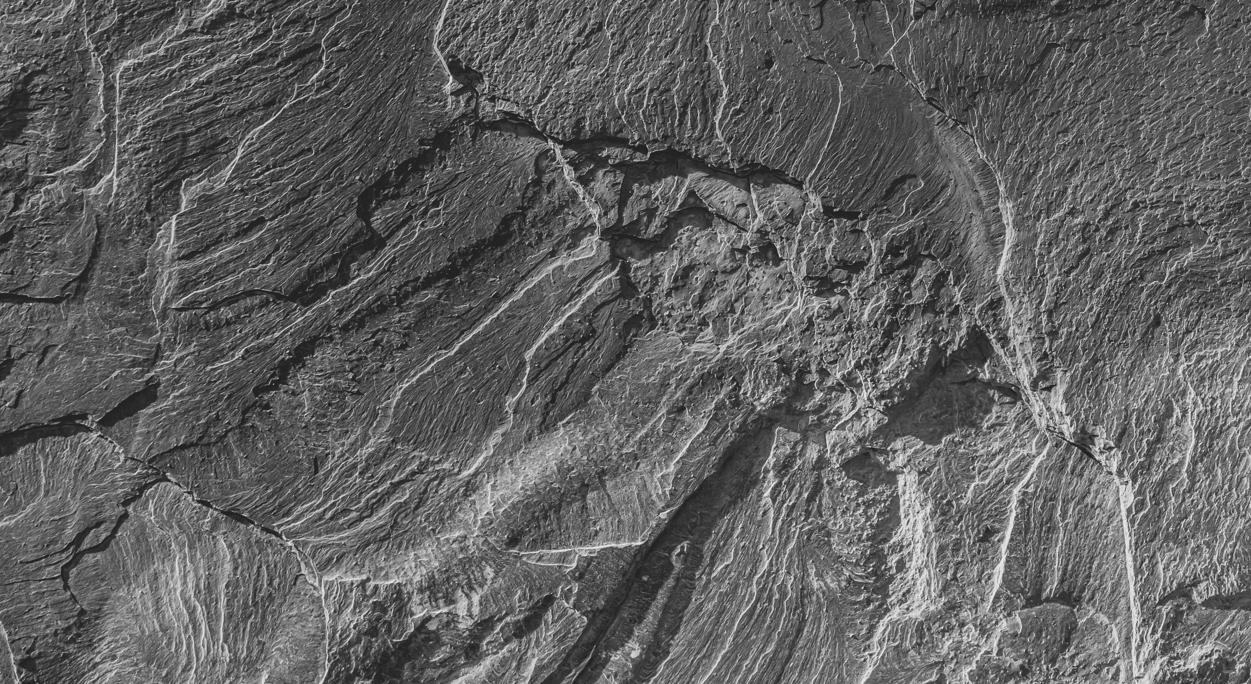 grayscale photo of rock formation