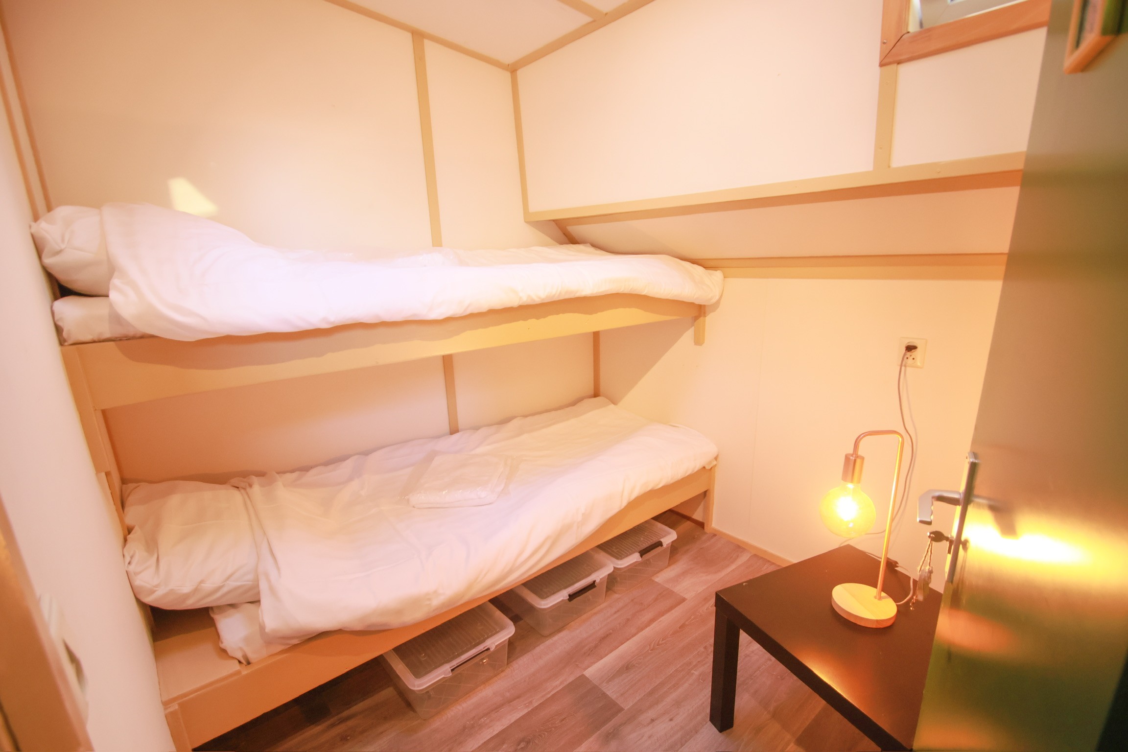 Gray sectional sofa with black coffee table and blue rug