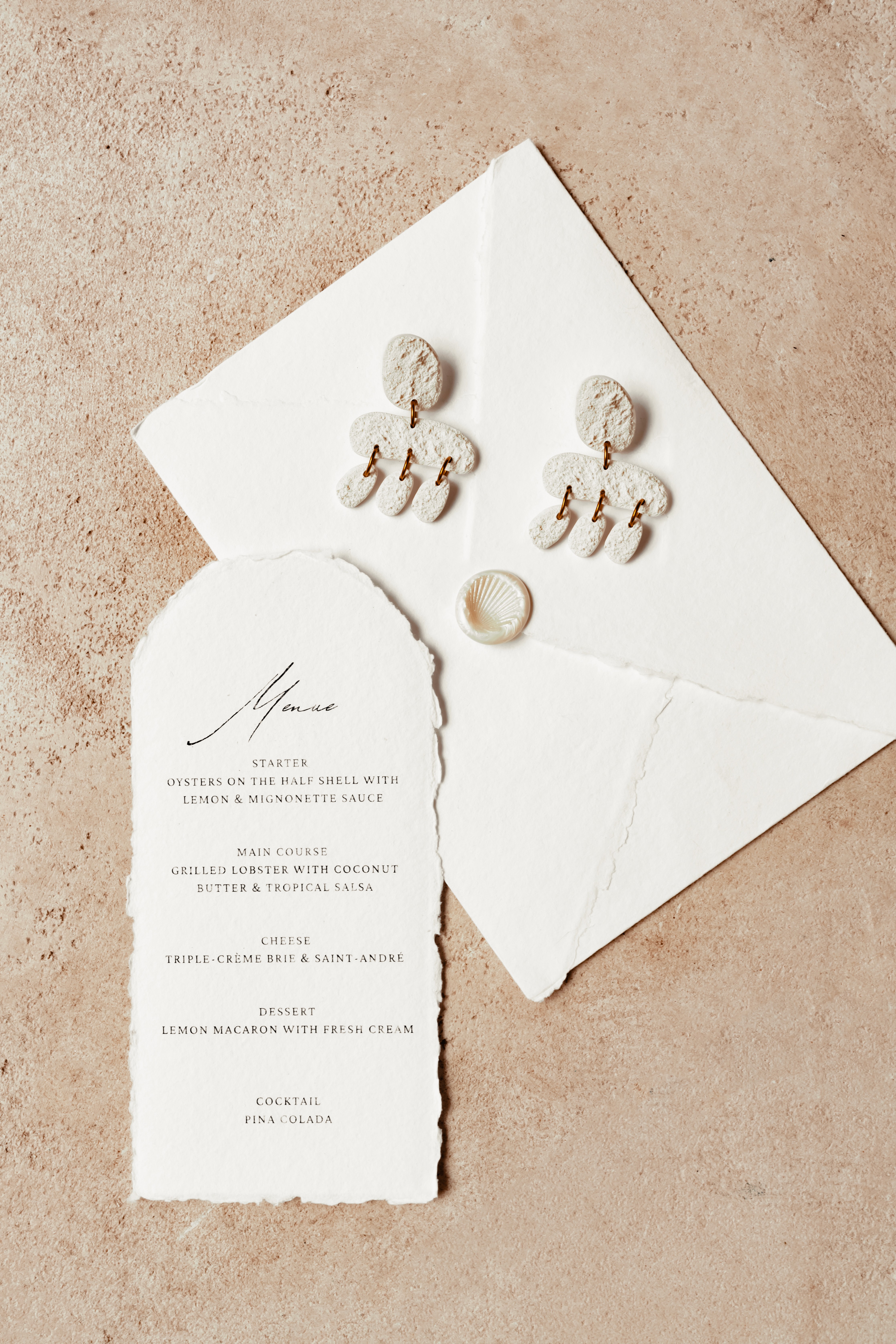 A beautifully decorated wedding cake featuring red and white roses.