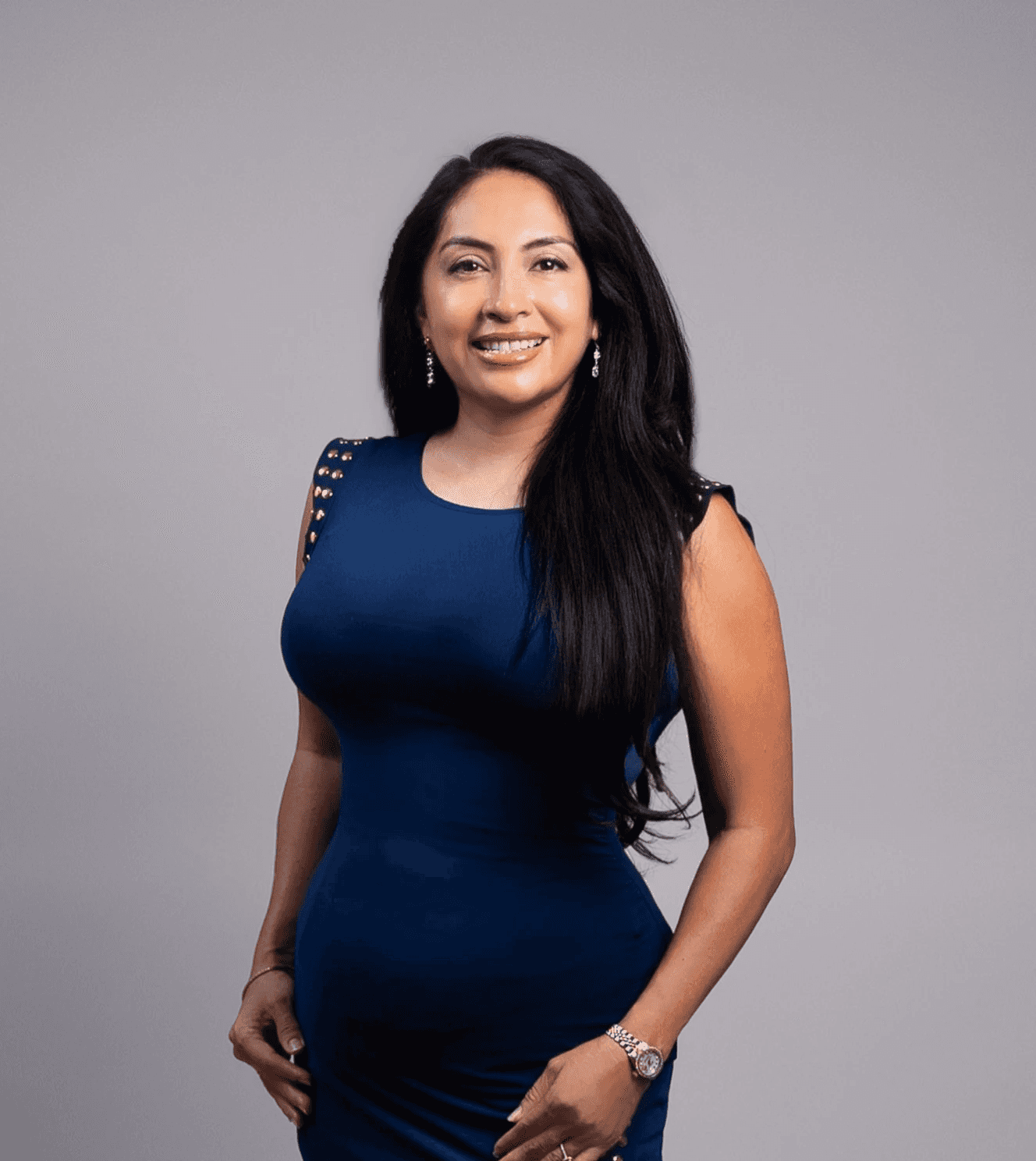 Black and white portrait of a smiling person with curly hair