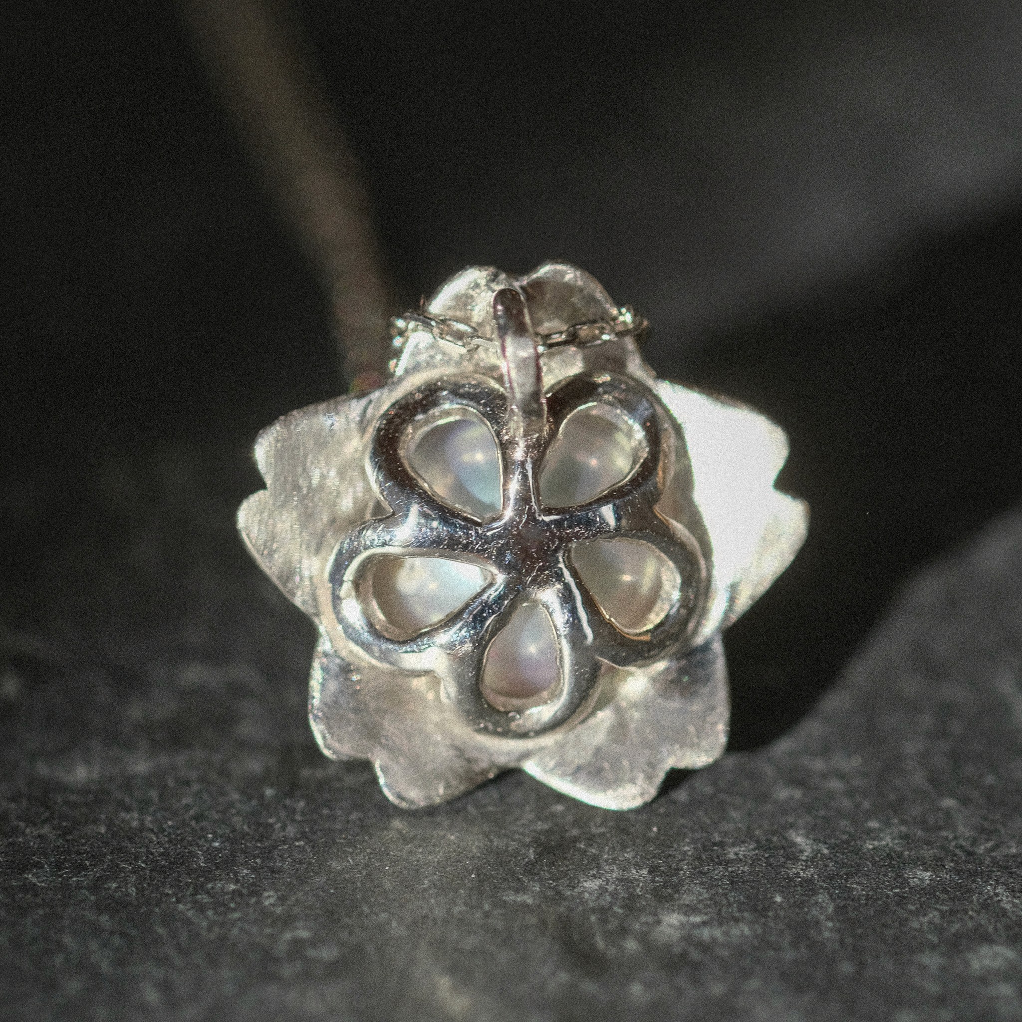 The back of a platinum sakura pendant