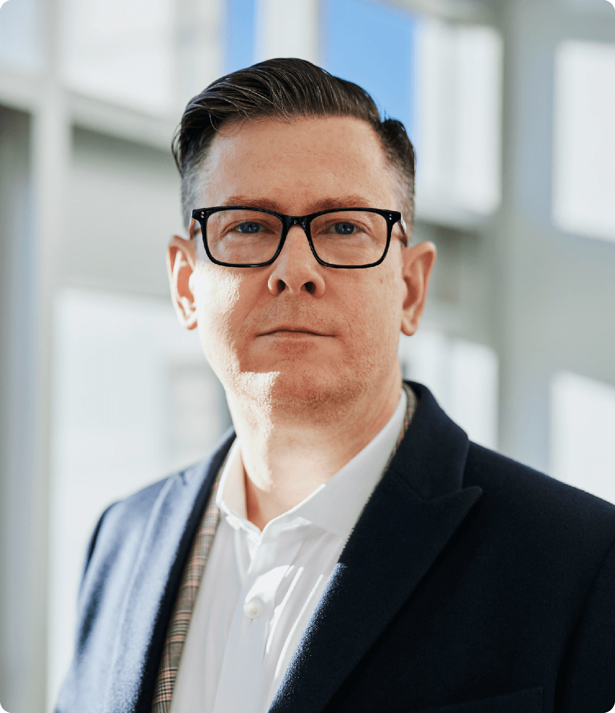 man standing beside wall