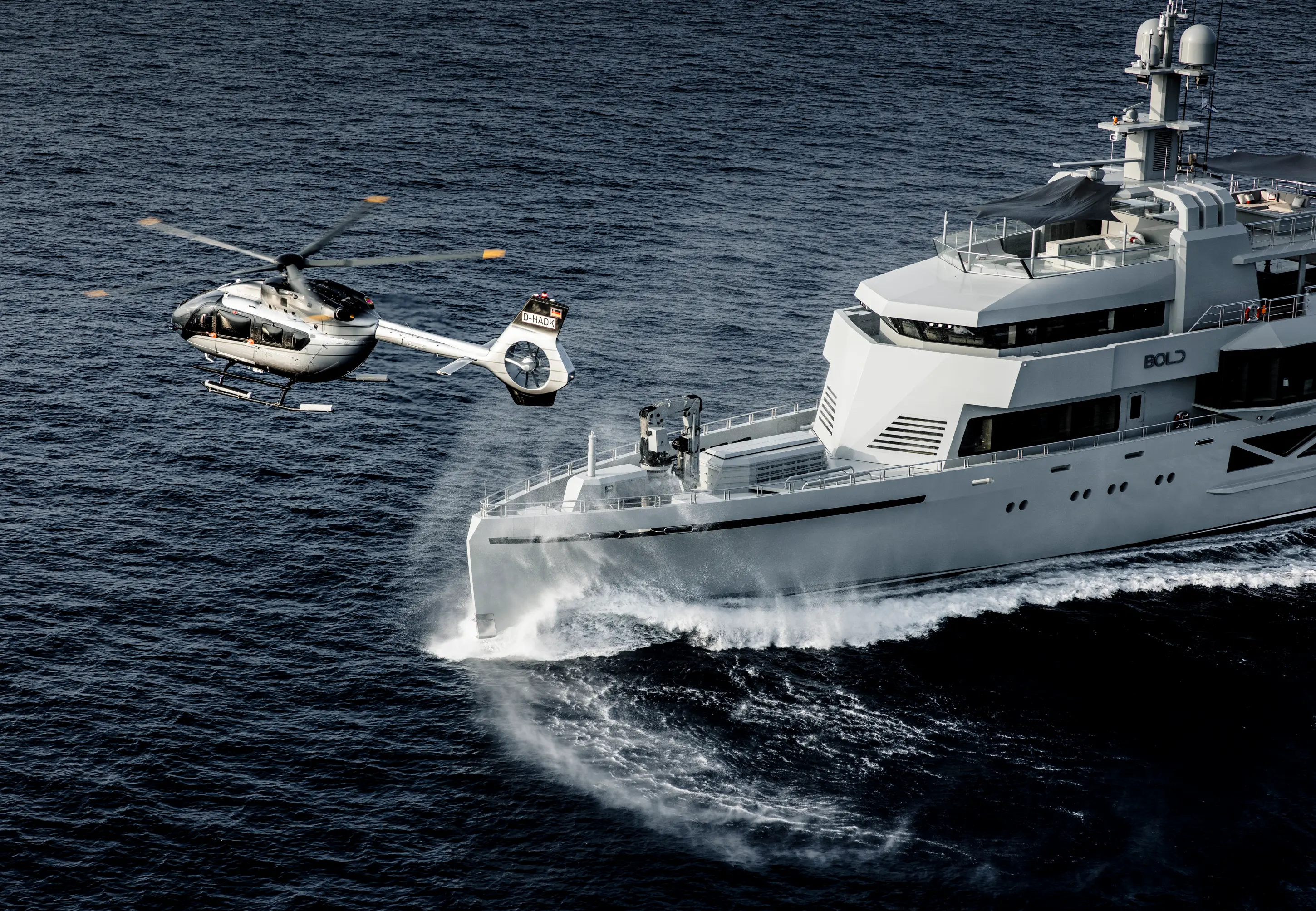 Minimal beige lounge with white sofas, turquoise decor.