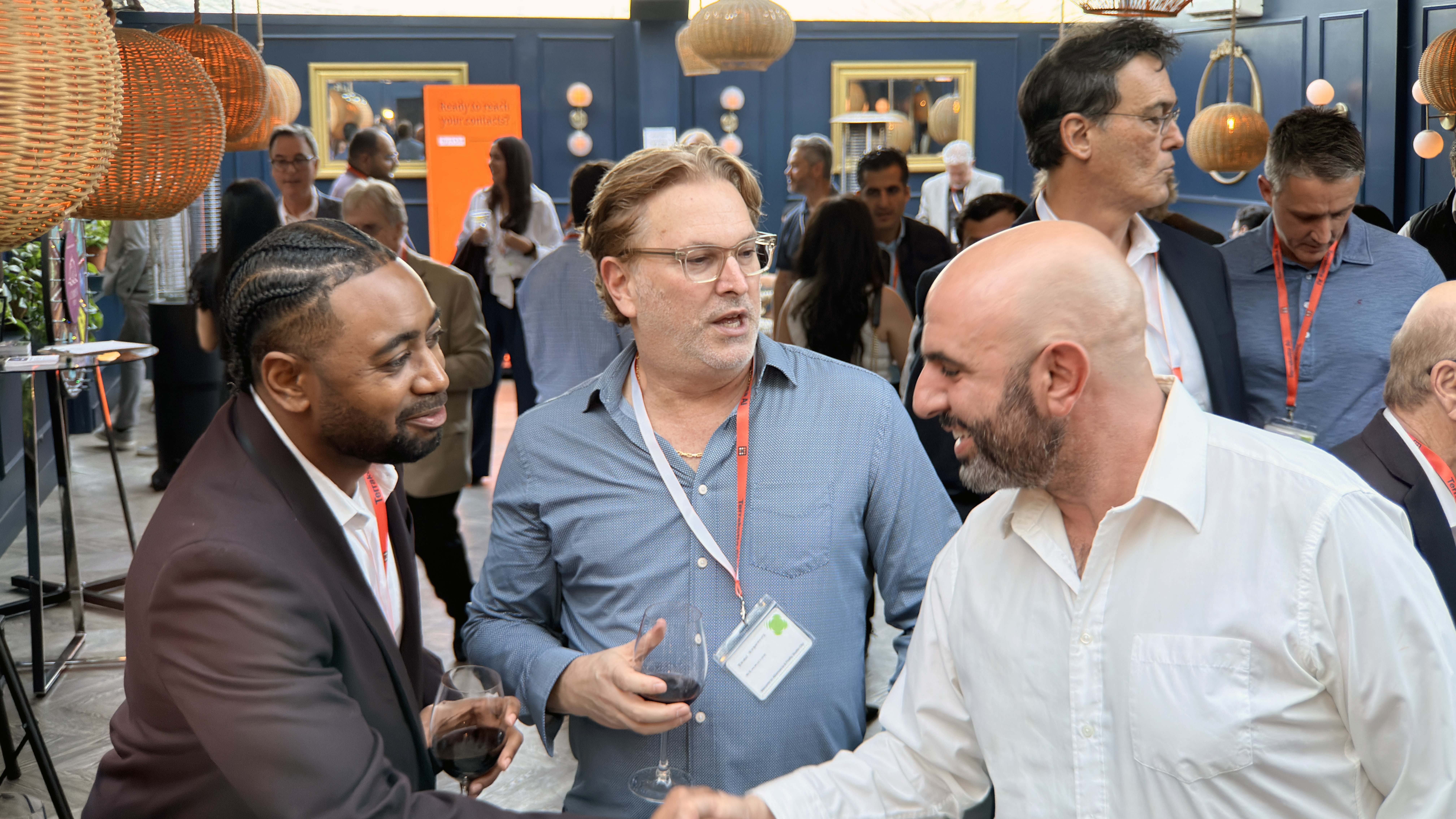 A hand using pink color laptop at pink desk